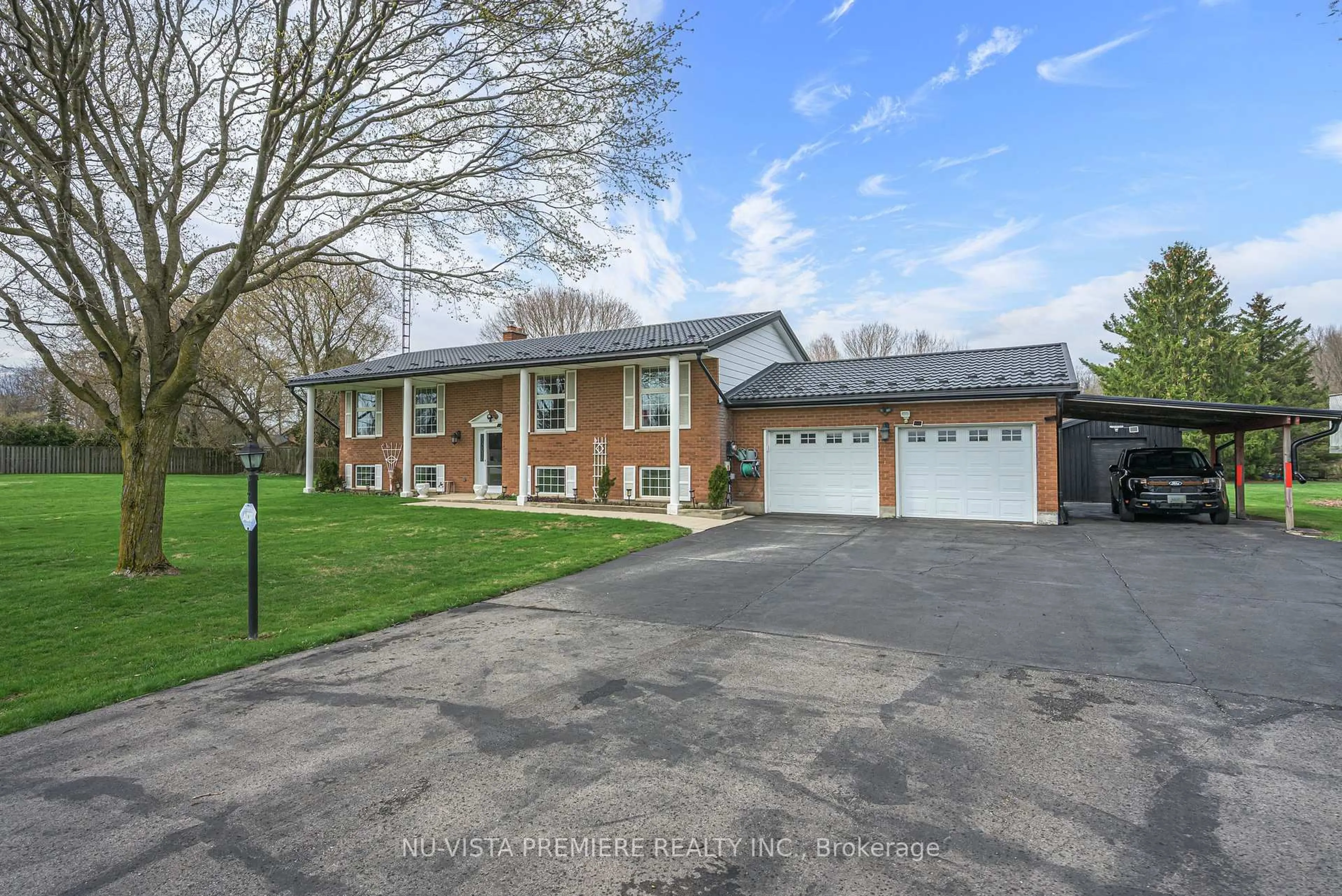 A pic from outside/outdoor area/front of a property/back of a property/a pic from drone, street for 15298 Medway Rd, Middlesex Centre Ontario N0M 1C0