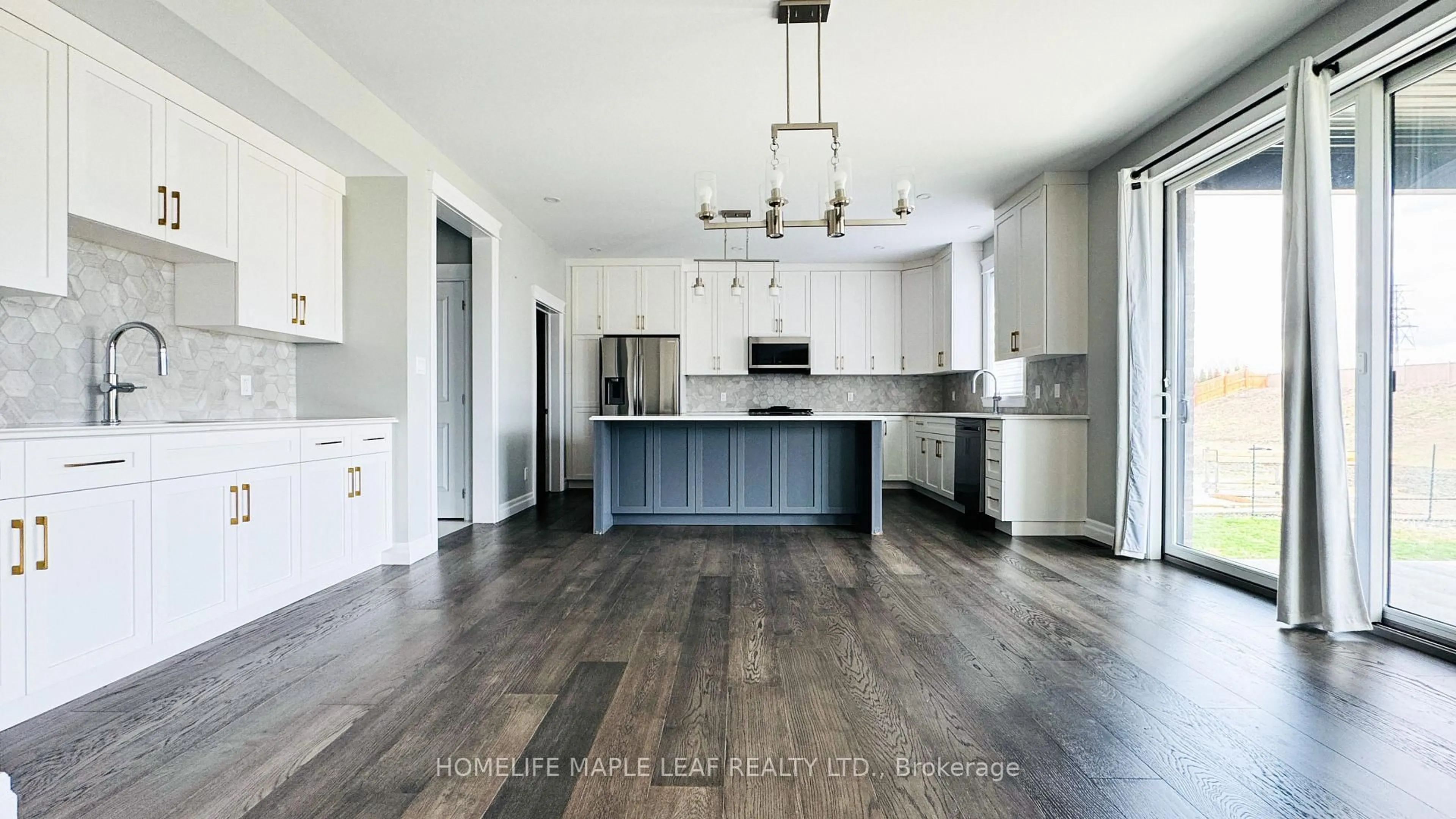 Open concept kitchen, wood/laminate floor for 310 Blake Ave, Lakeshore Ontario N8L 1B6