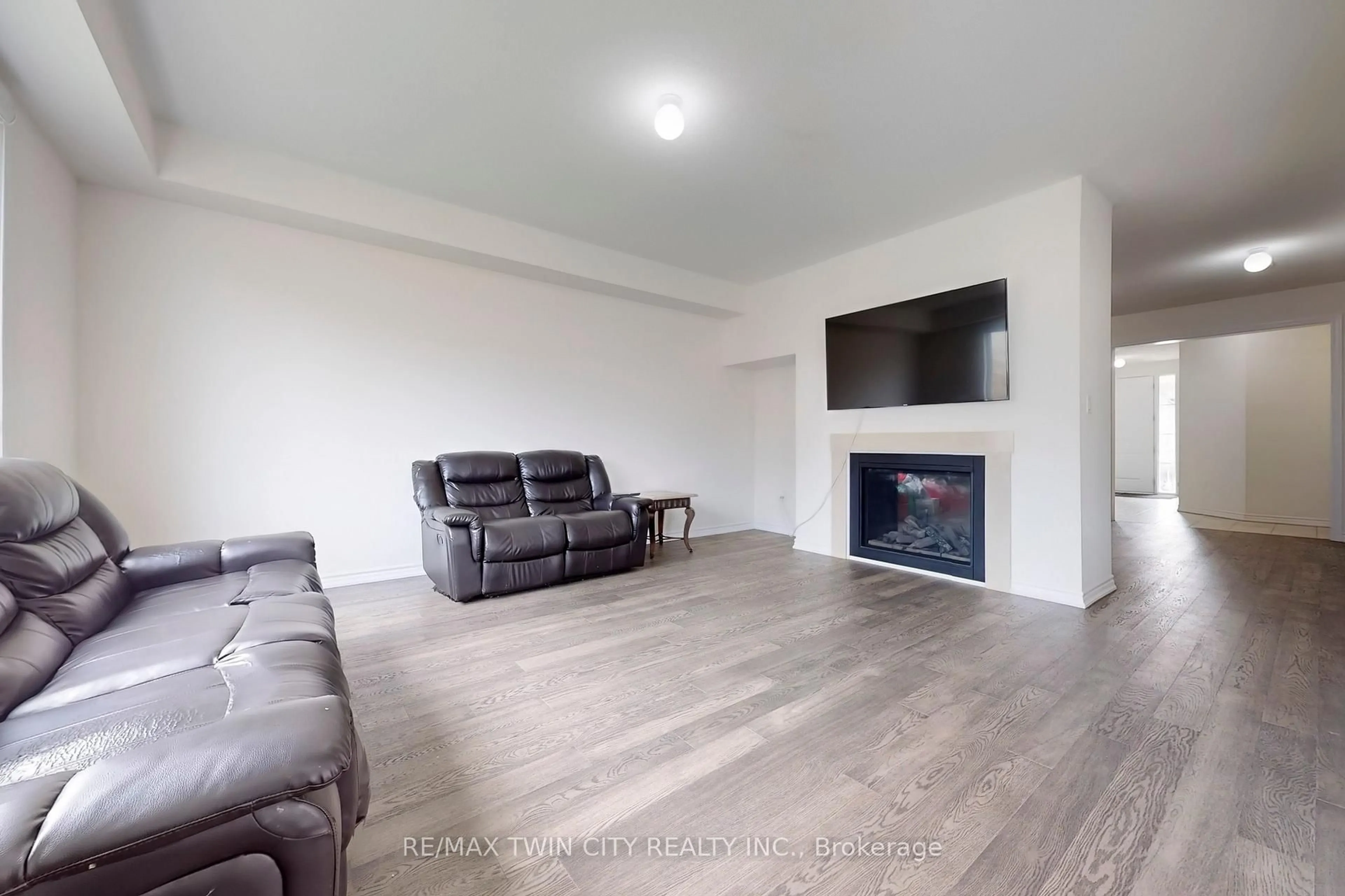 Living room with furniture, wood/laminate floor for 630 Lemay Grve, Peterborough Ontario K9K 0G9