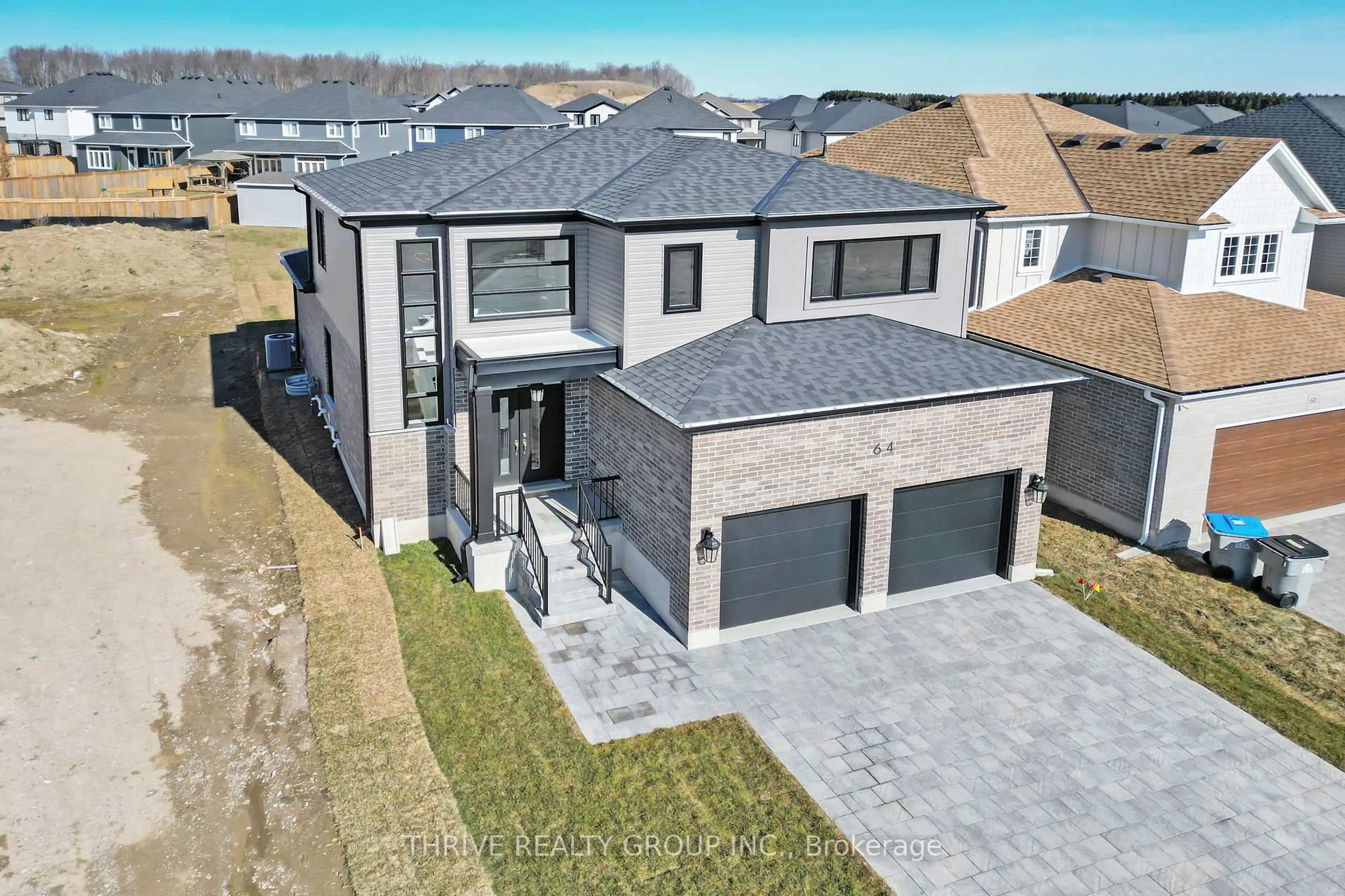 A pic from outside/outdoor area/front of a property/back of a property/a pic from drone, street for 64 Basil Cres, Middlesex Centre Ontario N0M 2A0
