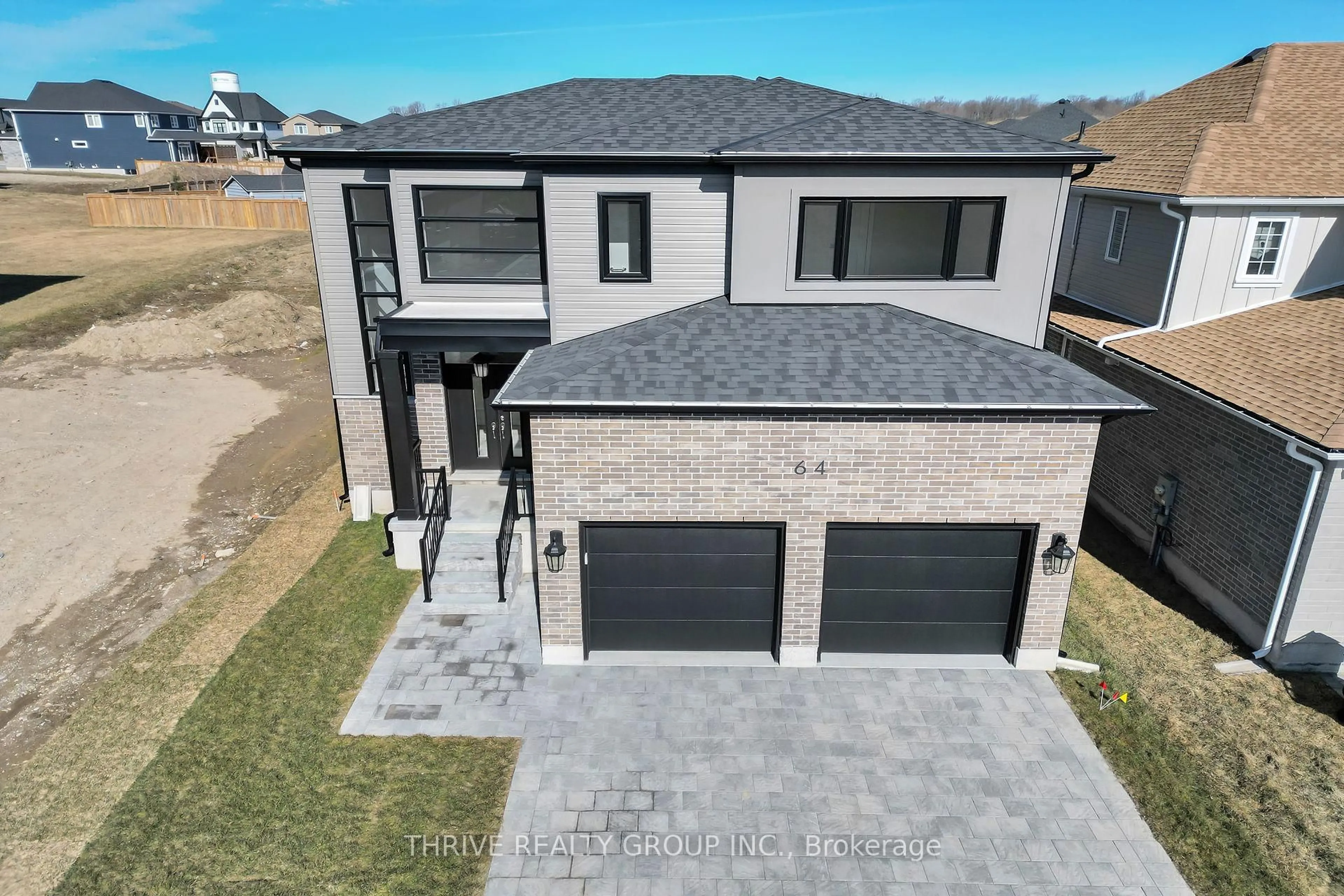 A pic from outside/outdoor area/front of a property/back of a property/a pic from drone, street for 64 Basil Cres, Middlesex Centre Ontario N0M 2A0