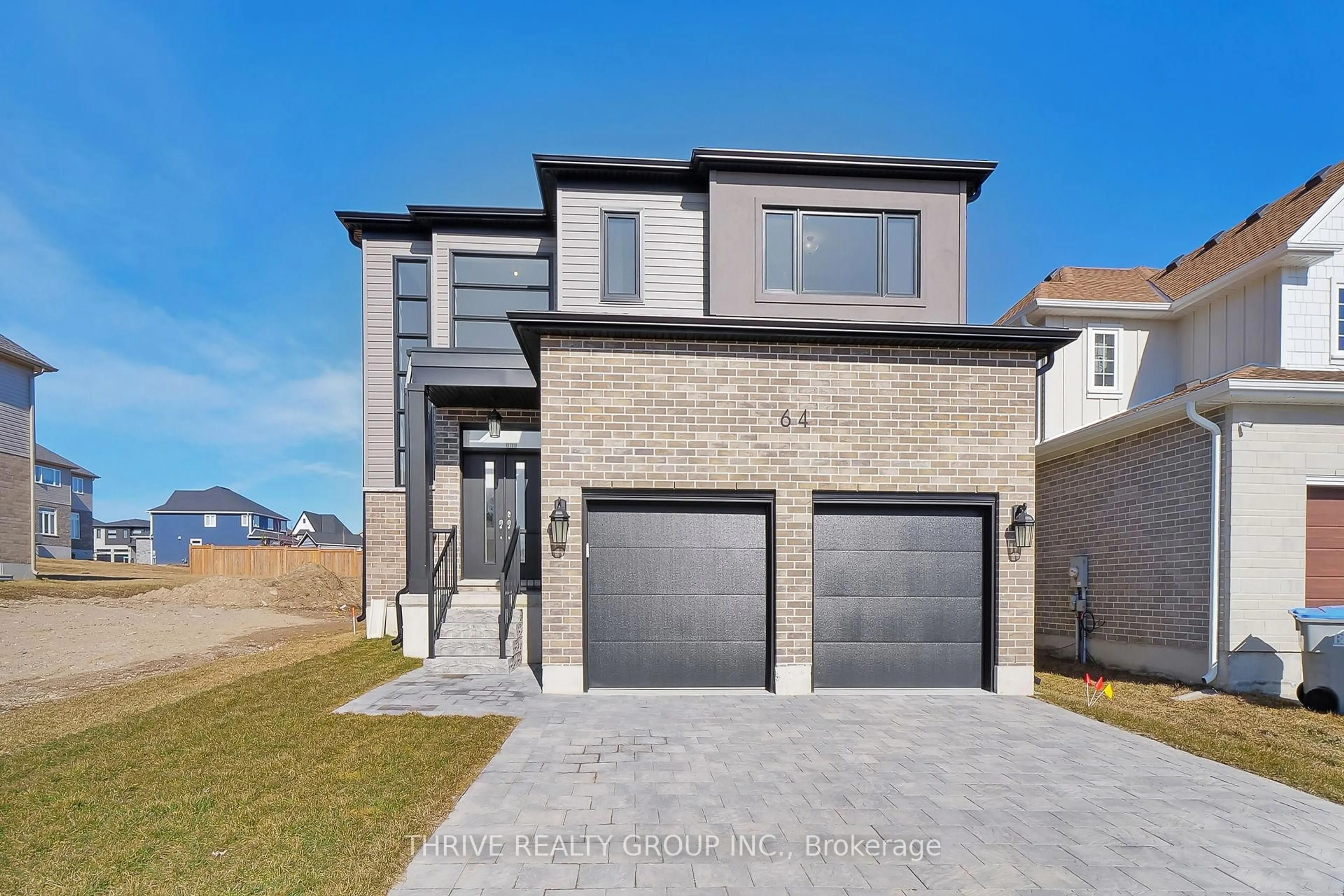 Home with brick exterior material, street for 64 Basil Cres, Middlesex Centre Ontario N0M 2A0