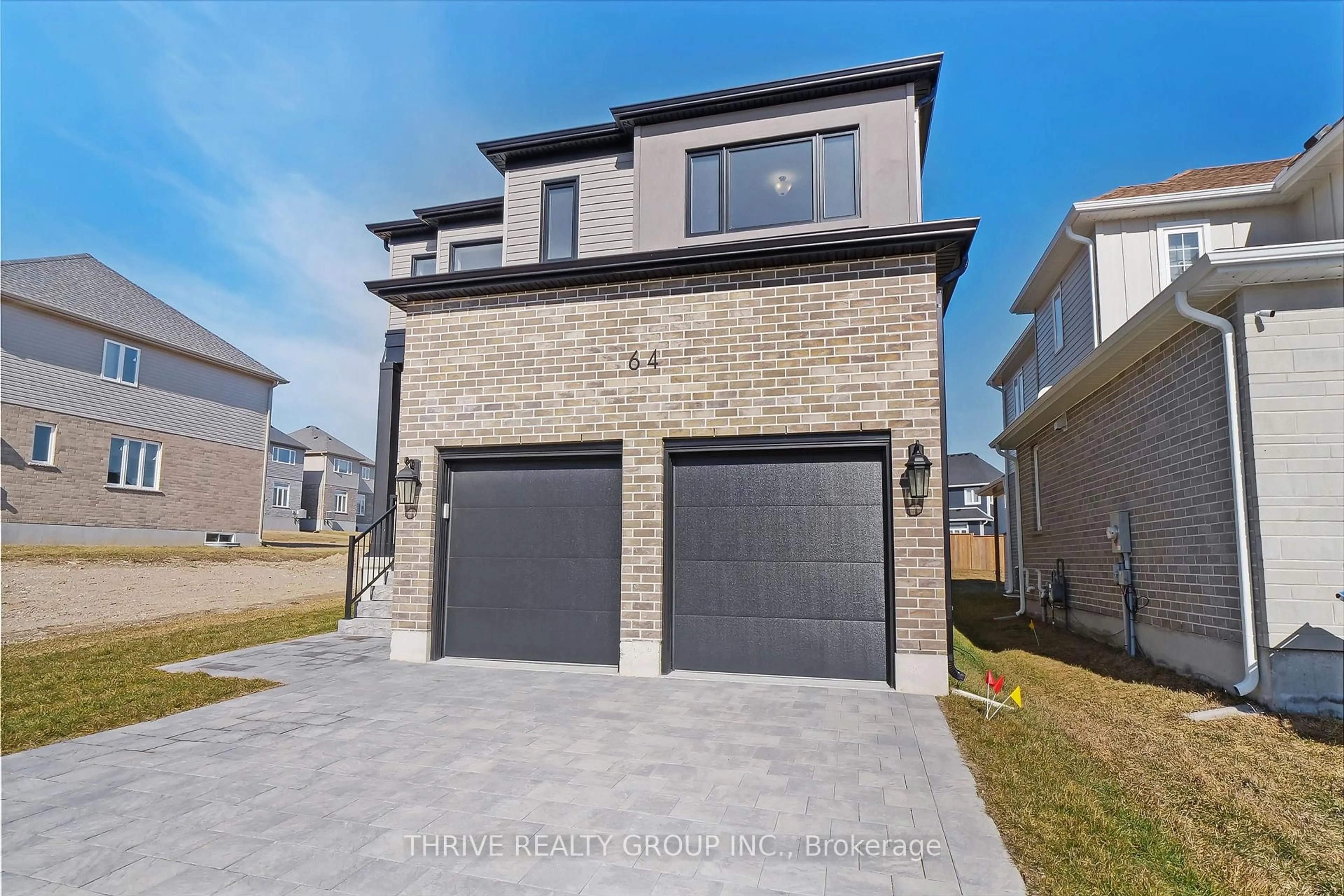 Home with brick exterior material, street for 64 Basil Cres, Middlesex Centre Ontario N0M 2A0