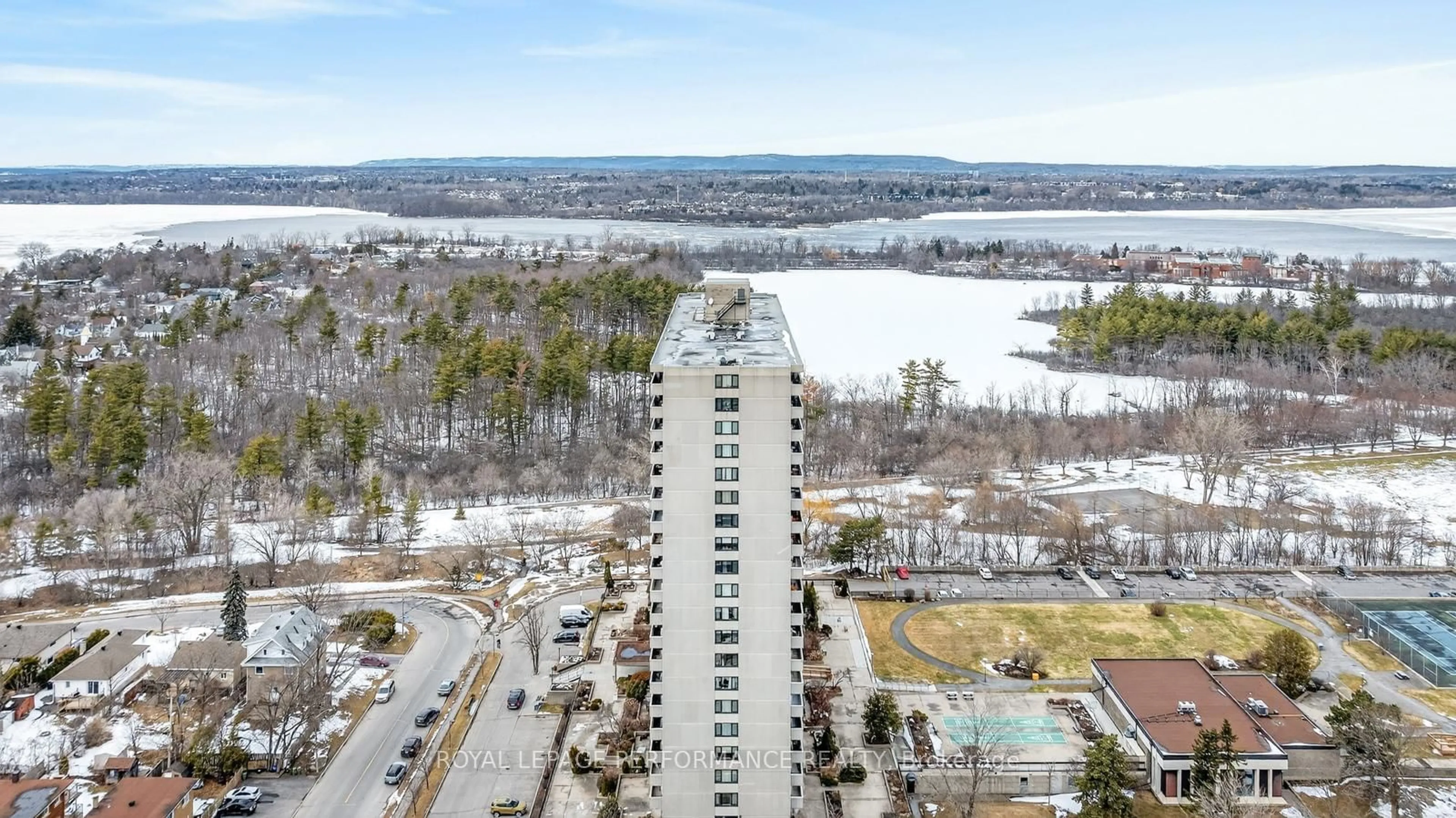 A pic from outside/outdoor area/front of a property/back of a property/a pic from drone, water/lake/river/ocean view for 265 Poulin Ave #207, Ottawa Ontario K2B 7Y8