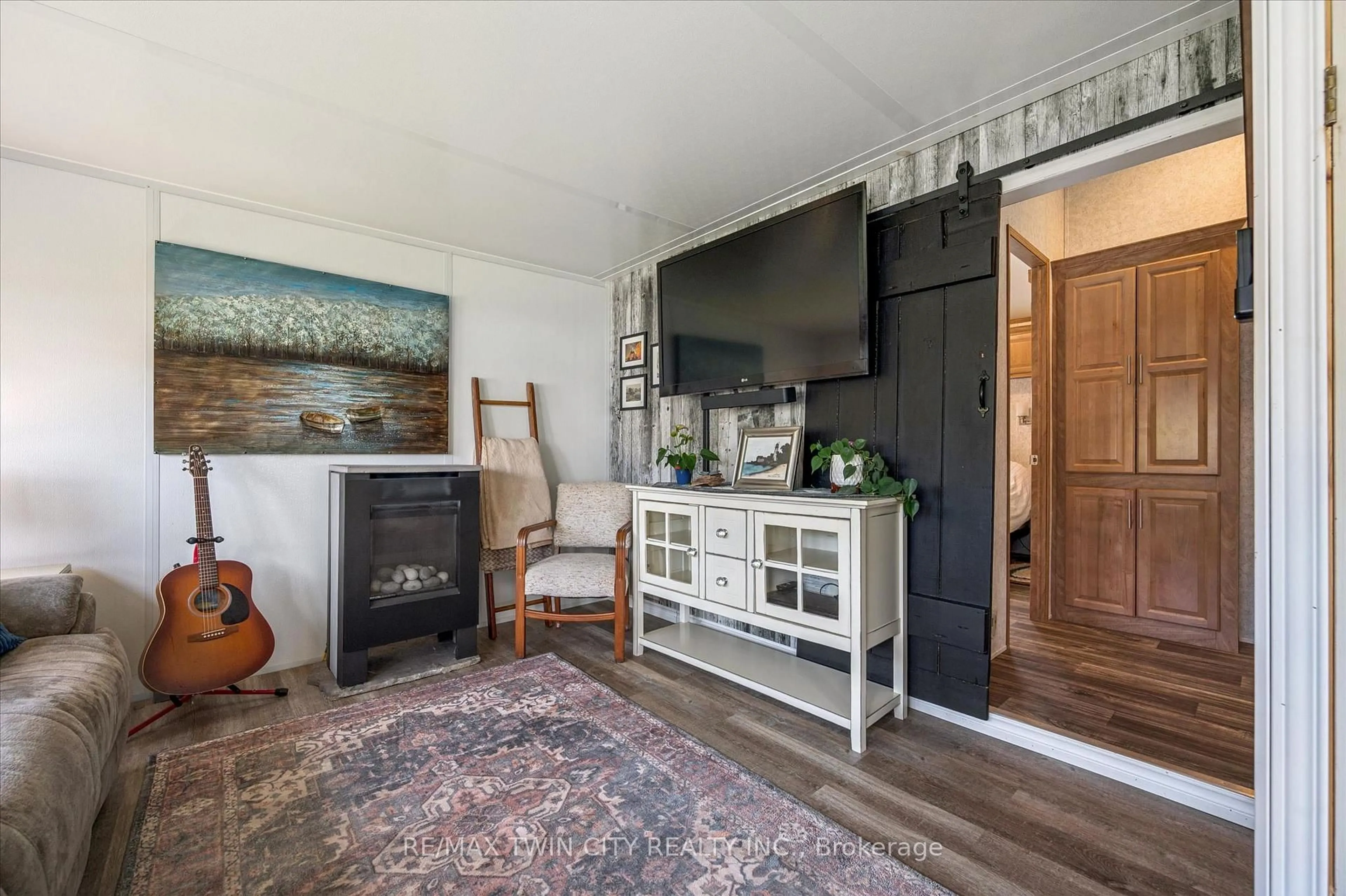 Living room with furniture, wood/laminate floor for 930 Lakeshore Rd #83, Norfolk Ontario N0J 1T0