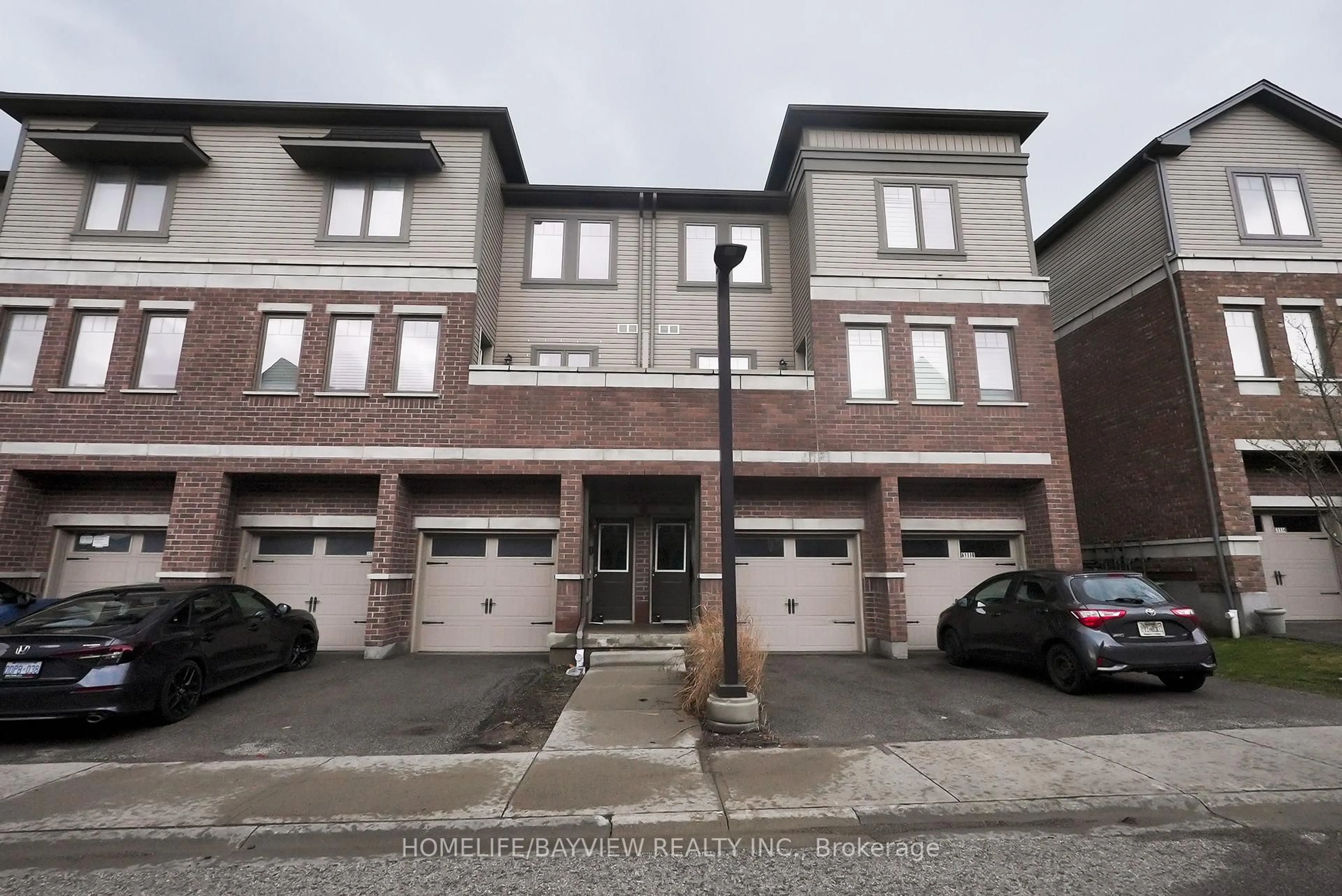 A pic from outside/outdoor area/front of a property/back of a property/a pic from drone, street for 70 Willowrun Dr #B1, Kitchener Ontario N2A 0J3