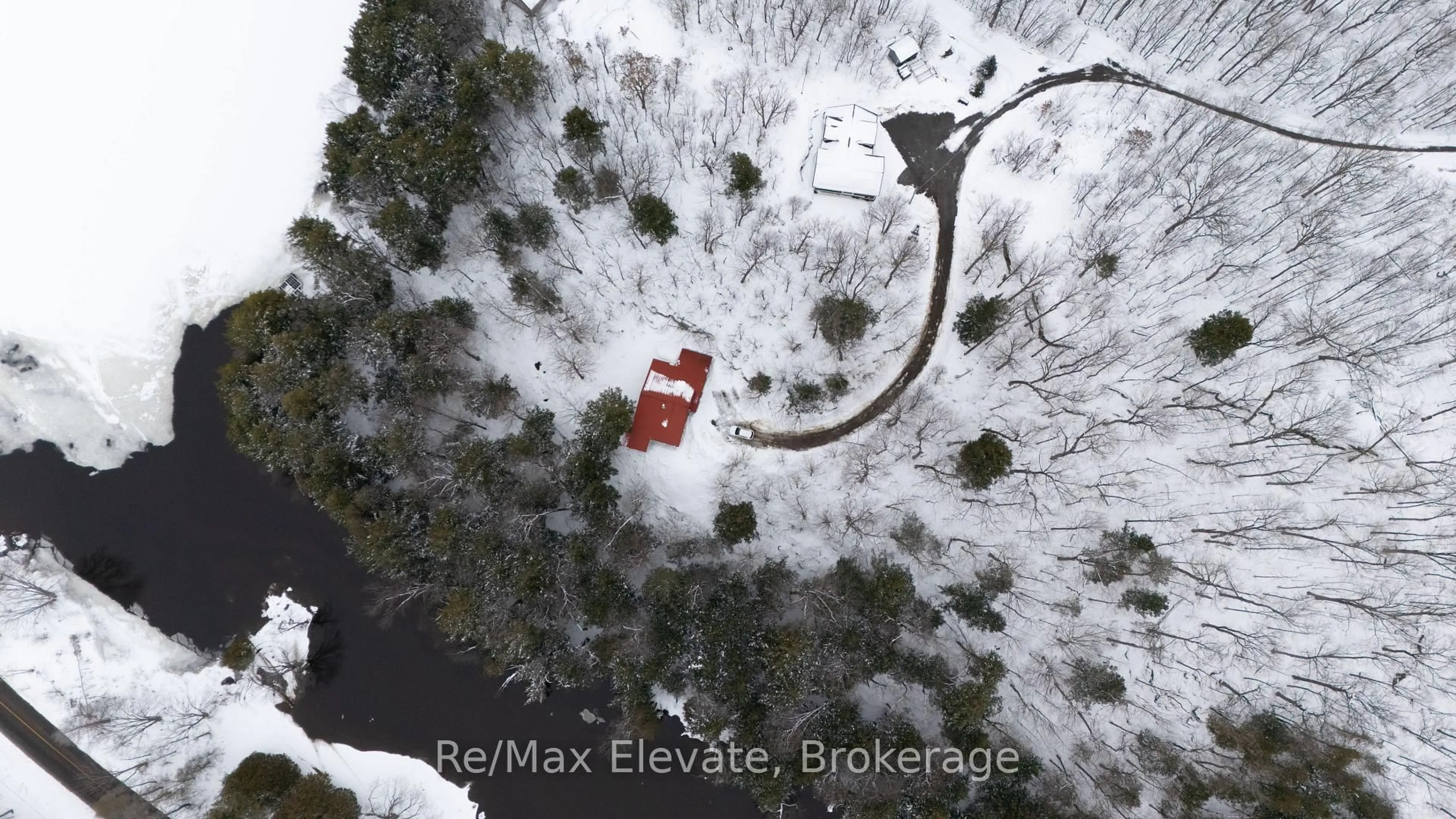 A pic from outside/outdoor area/front of a property/back of a property/a pic from drone, street for 1012 VILLAGE 1 Rd #3, Muskoka Lakes Ontario P0B 1M0