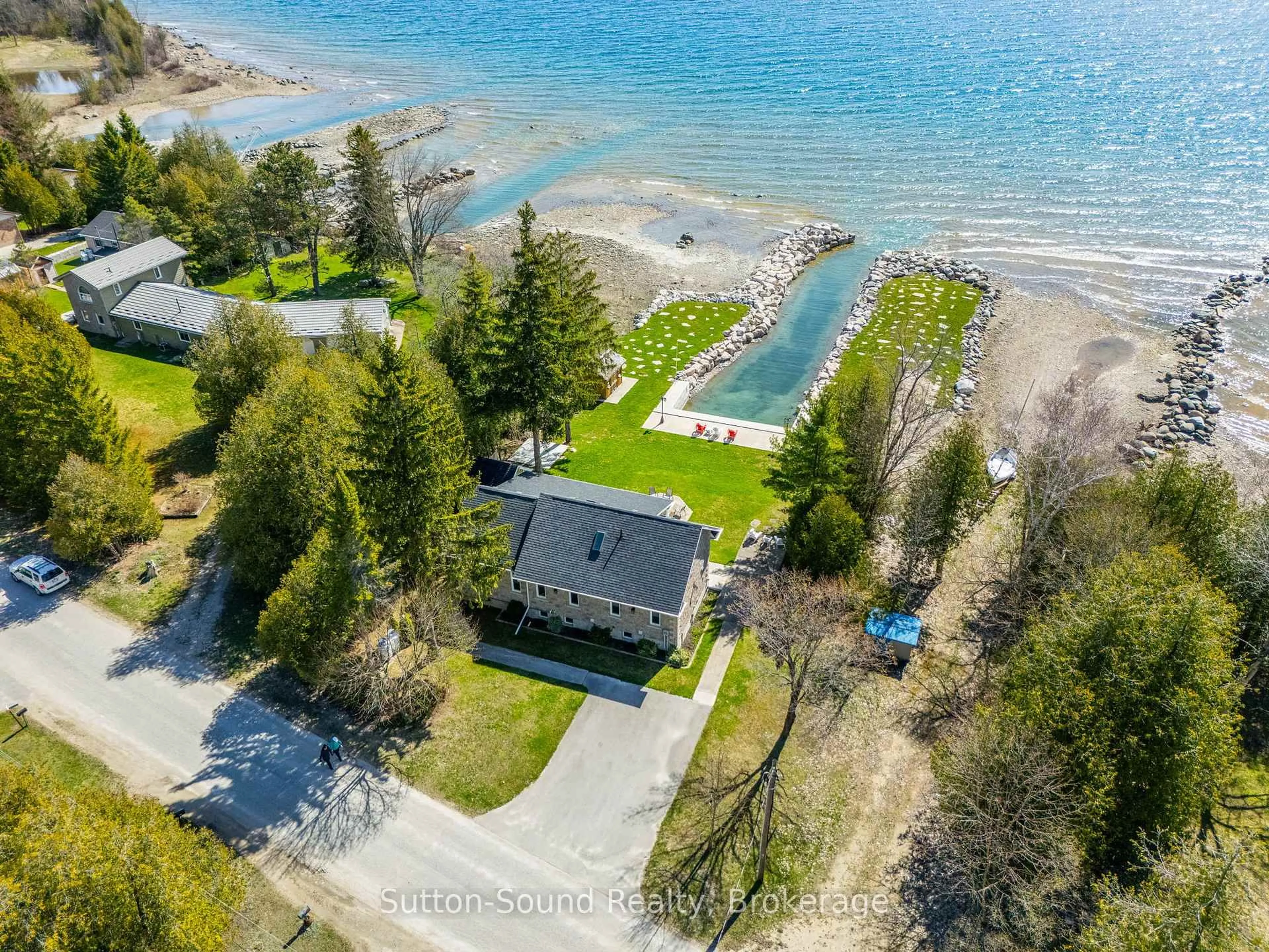 A pic from outside/outdoor area/front of a property/back of a property/a pic from drone, water/lake/river/ocean view for 339605 Presqu'ile Rd, Georgian Bluffs Ontario N0H 1S0