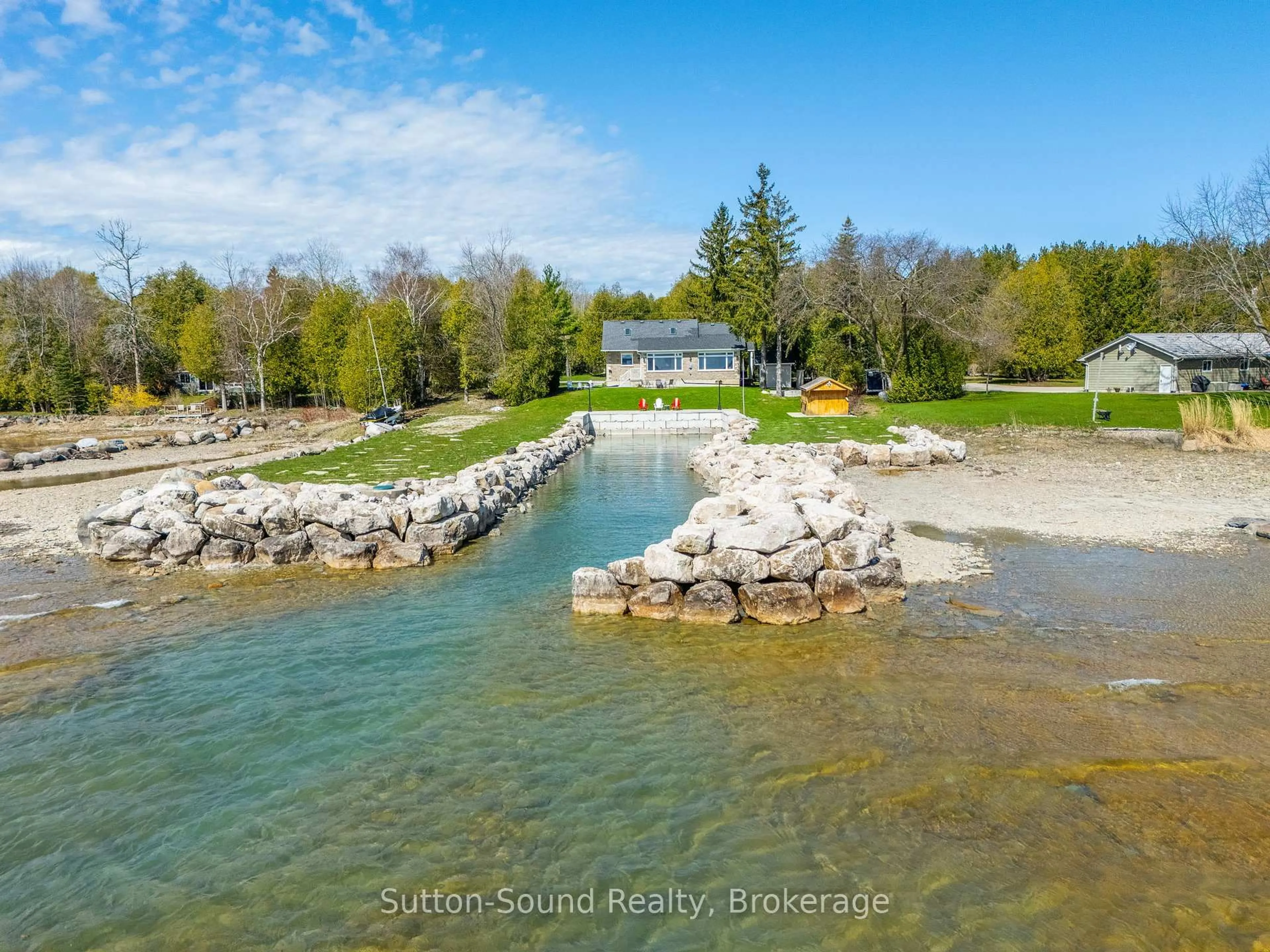 A pic from outside/outdoor area/front of a property/back of a property/a pic from drone, water/lake/river/ocean view for 339605 Presqu'ile Rd, Georgian Bluffs Ontario N0H 1S0