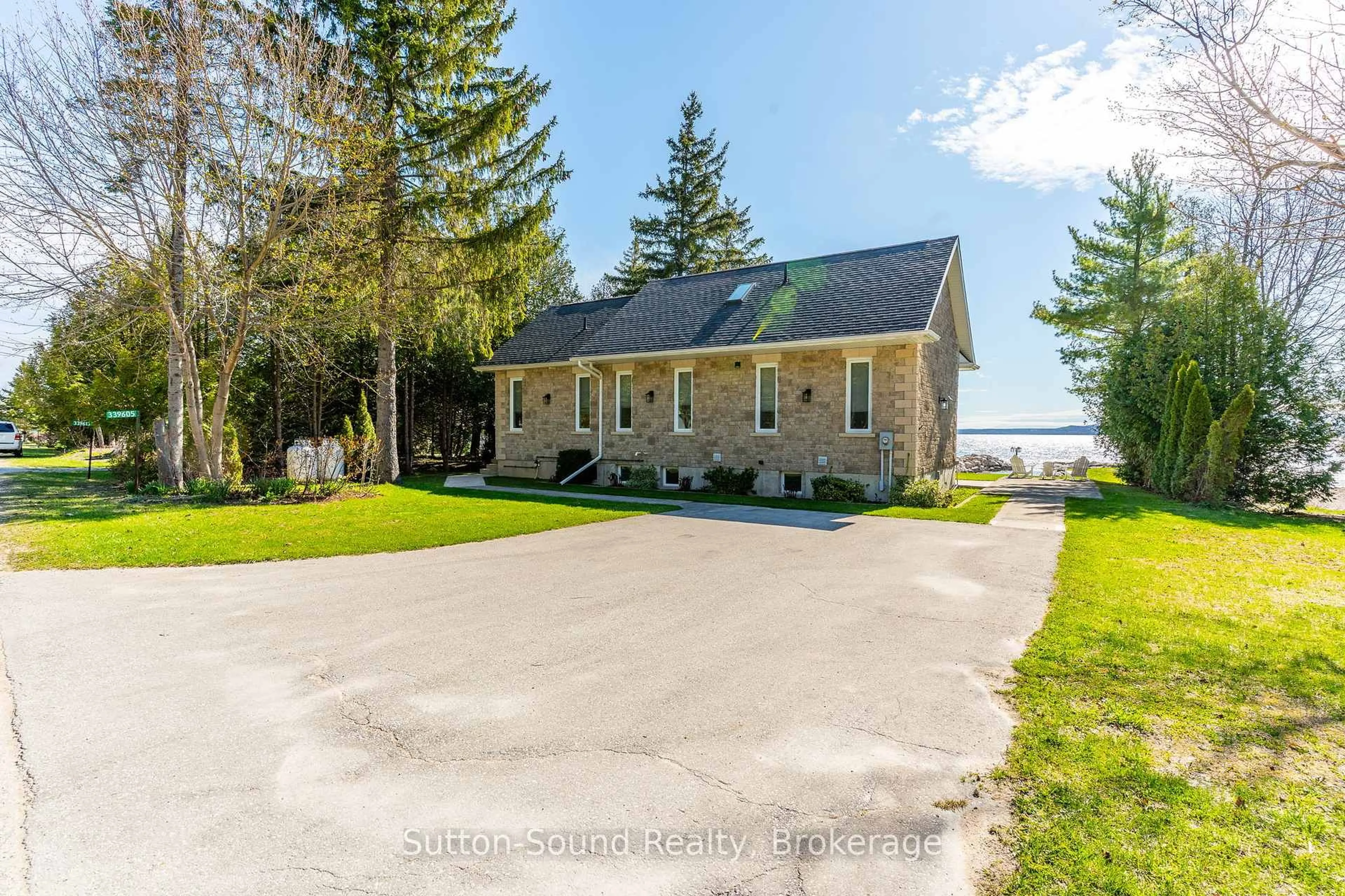 A pic from outside/outdoor area/front of a property/back of a property/a pic from drone, water/lake/river/ocean view for 339605 Presqu'ile Rd, Georgian Bluffs Ontario N0H 1S0