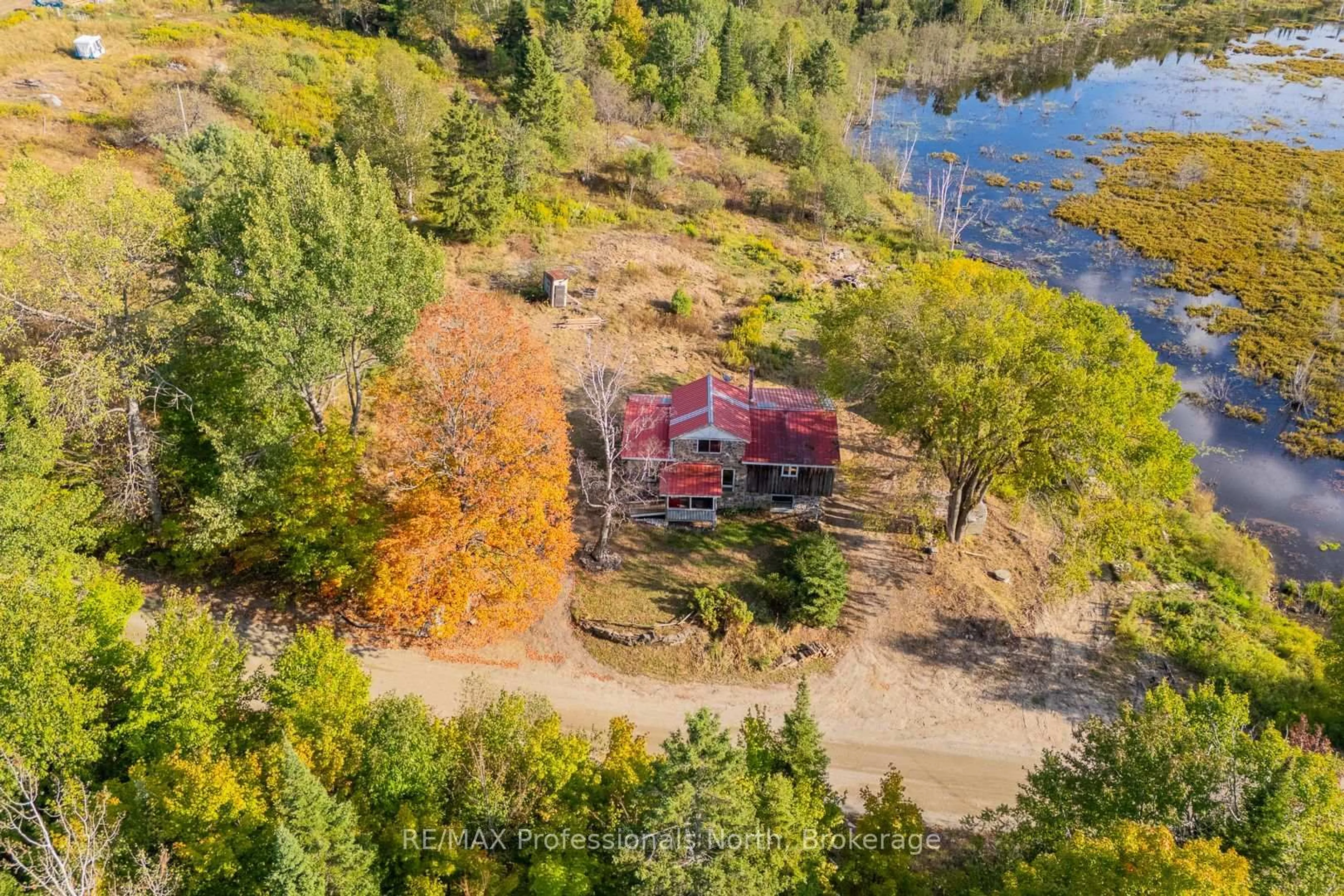 A pic from outside/outdoor area/front of a property/back of a property/a pic from drone, water/lake/river/ocean view for 1127 Fallowfield Rd, Dysart et al Ontario K0M 1S0