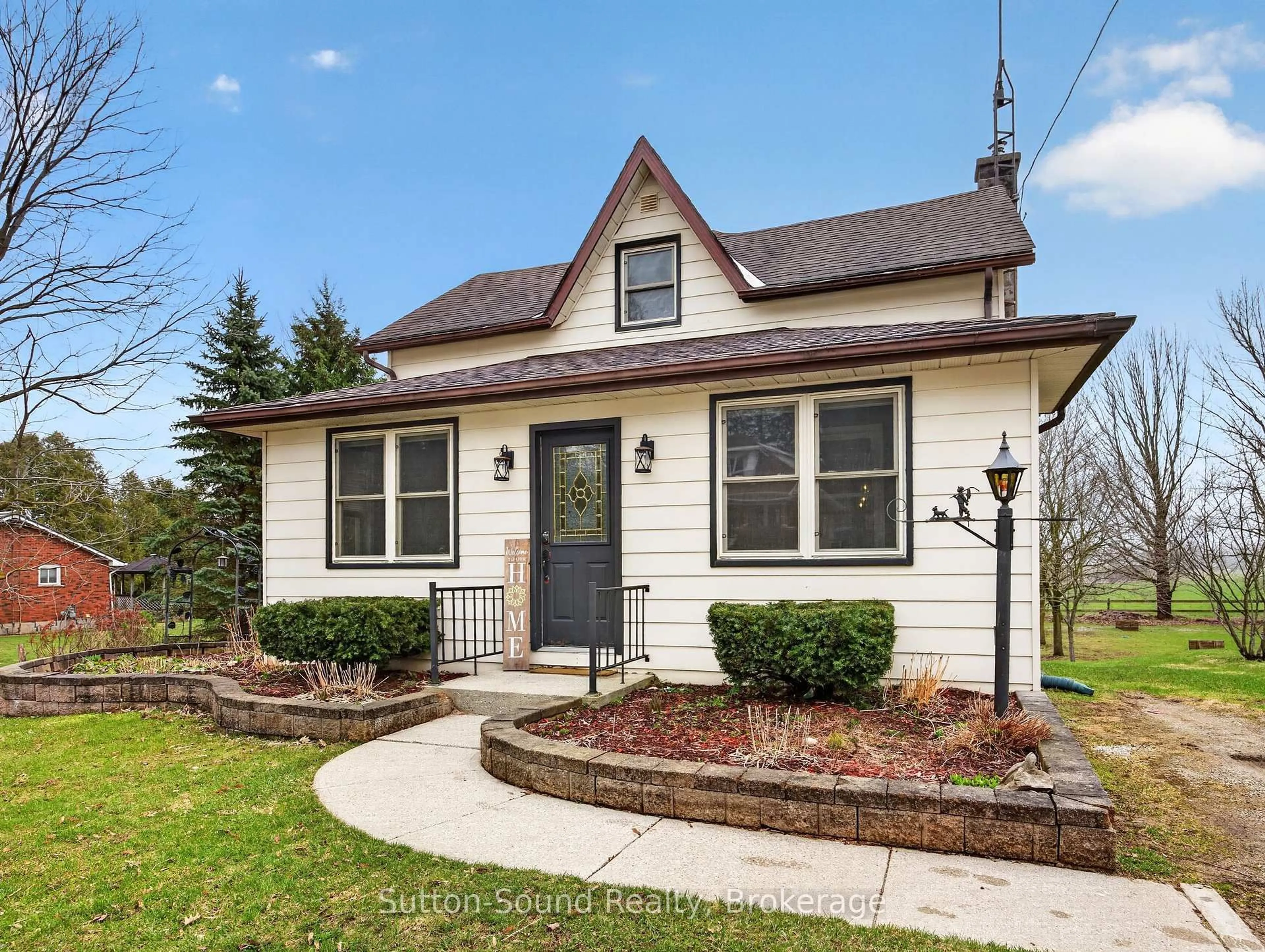 Home with vinyl exterior material, street for 102018 Grey Road 5 Rd, Georgian Bluffs Ontario N4K 5N5