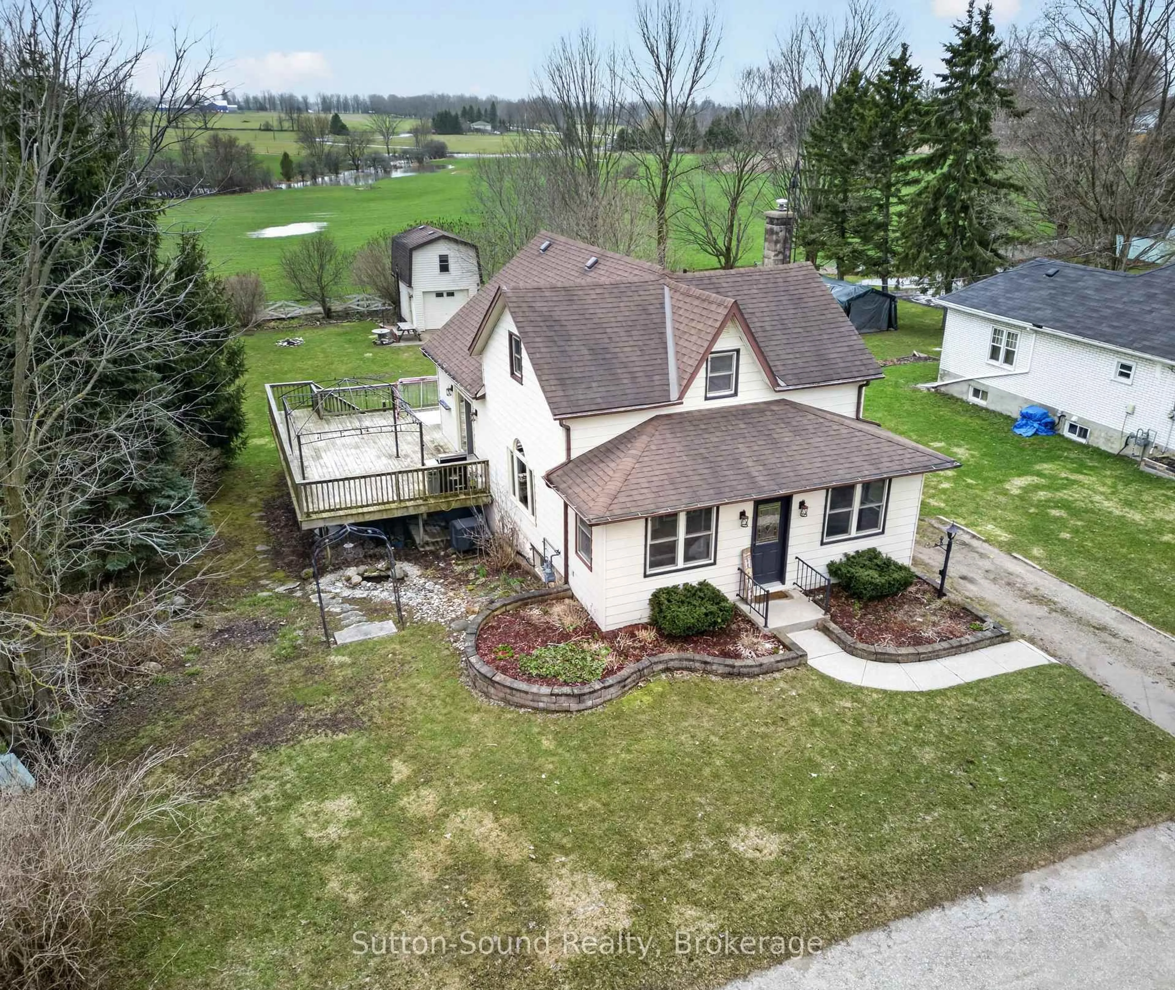 A pic from outside/outdoor area/front of a property/back of a property/a pic from drone, street for 102018 Grey Road 5 Rd, Georgian Bluffs Ontario N4K 5N5