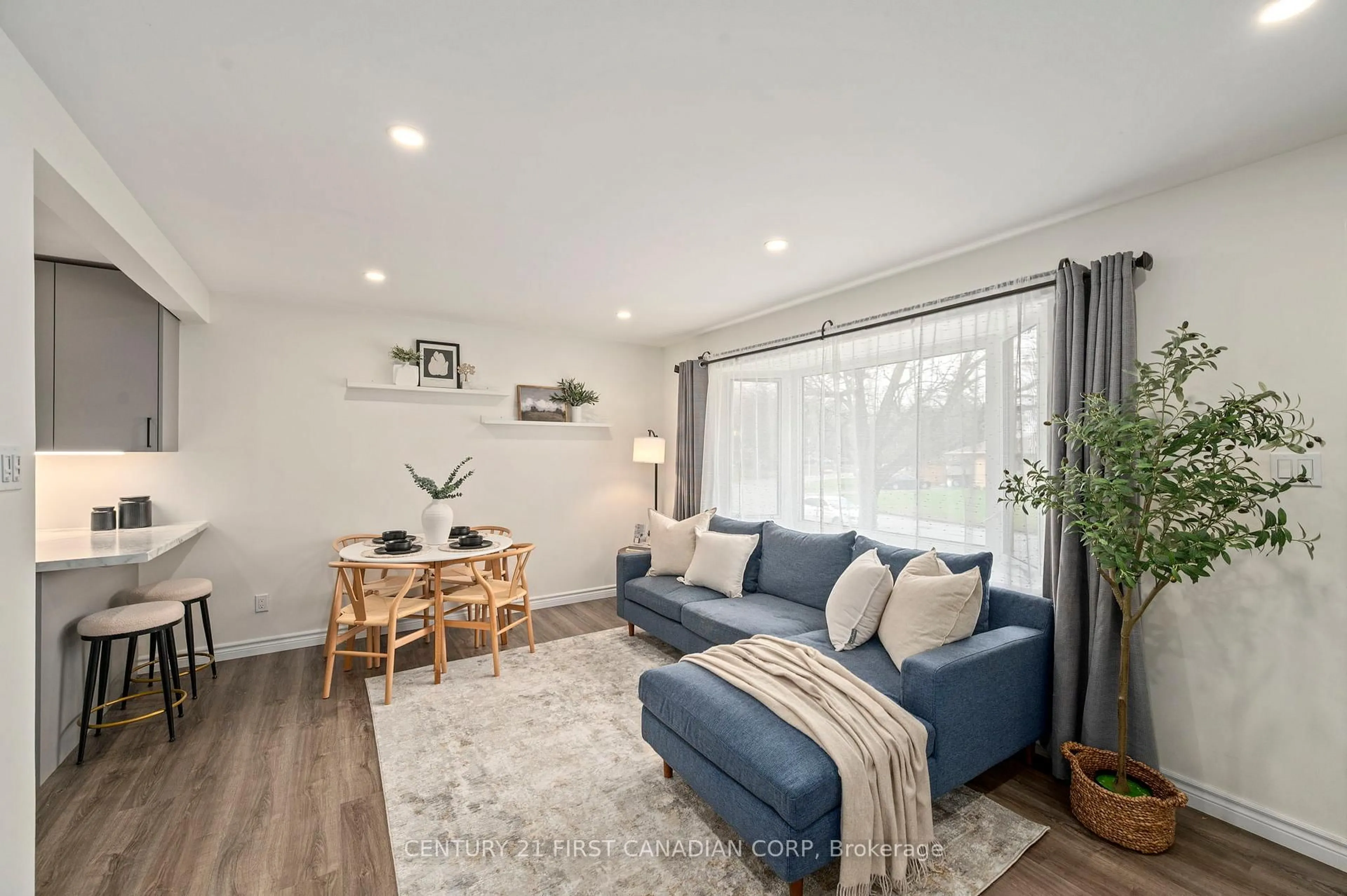 Living room with furniture, wood/laminate floor for 6 Breton Park Cres, London East Ontario N5W 1N1