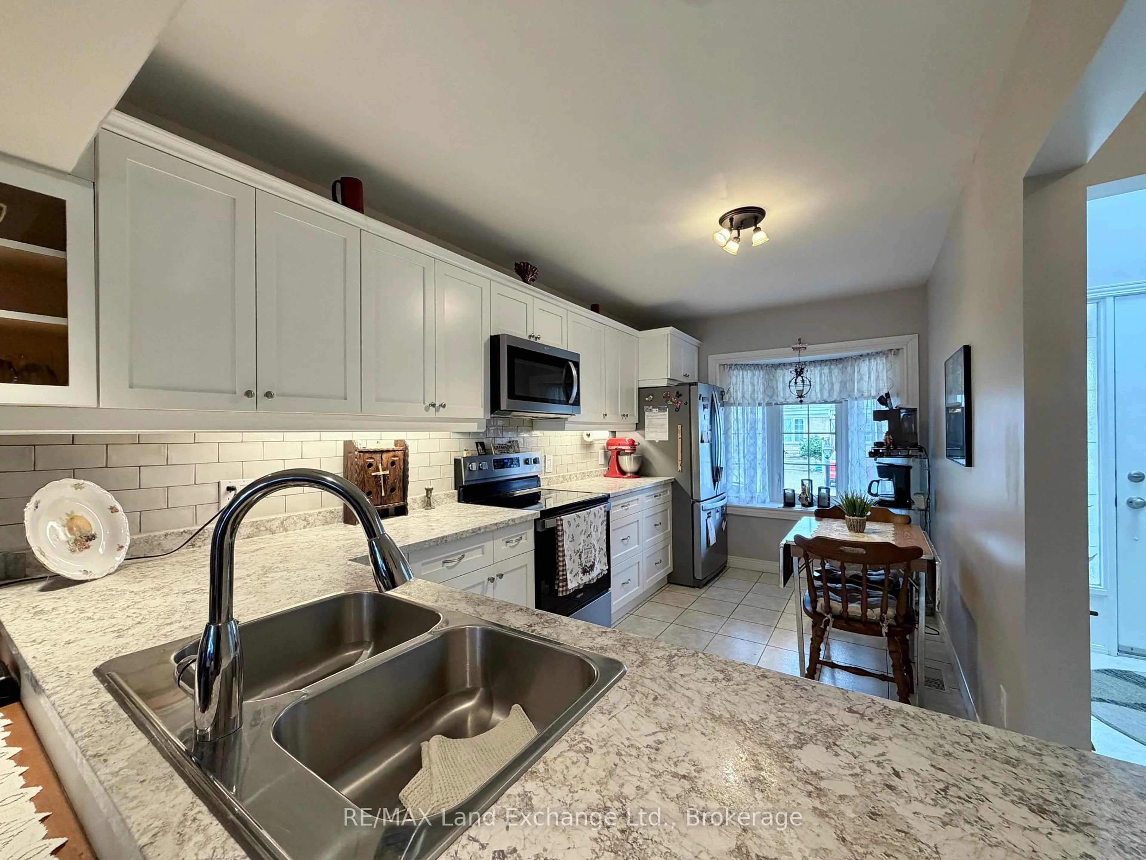 Open concept kitchen, ceramic/tile floor for 914 Arlington St #30, Saugeen Shores Ontario N0H 2C4