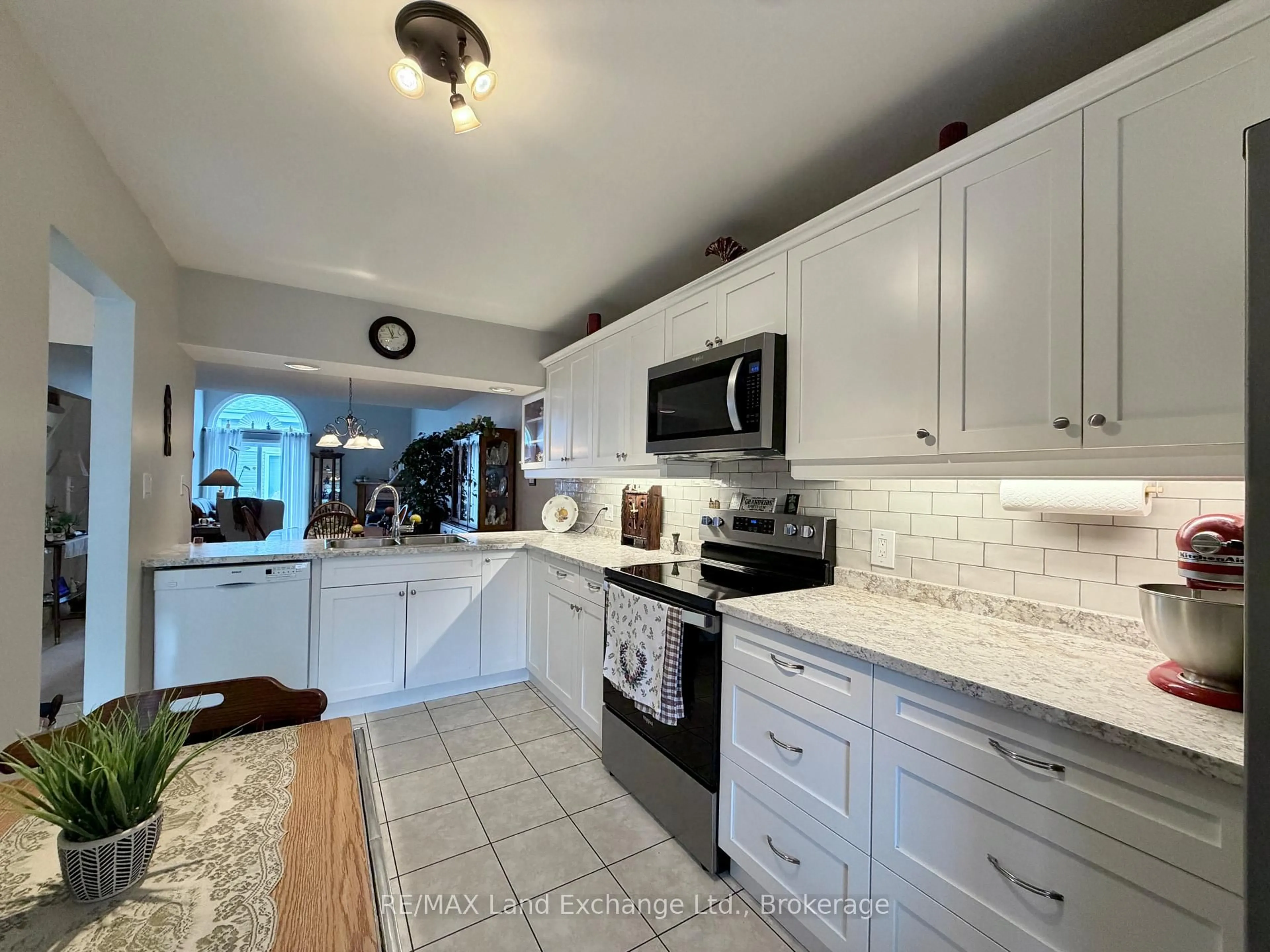 Open concept kitchen, ceramic/tile floor for 914 Arlington St #30, Saugeen Shores Ontario N0H 2C4