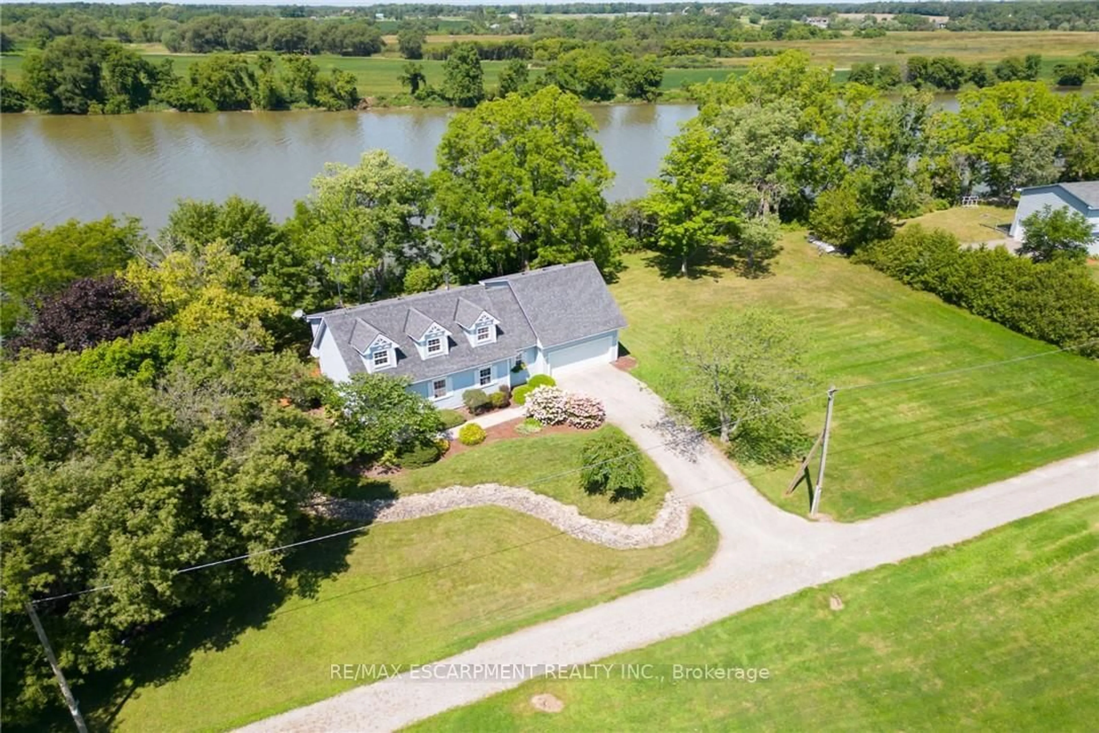 A pic from outside/outdoor area/front of a property/back of a property/a pic from drone, water/lake/river/ocean view for 1042 River Rd, Haldimand Ontario N0A 1E0