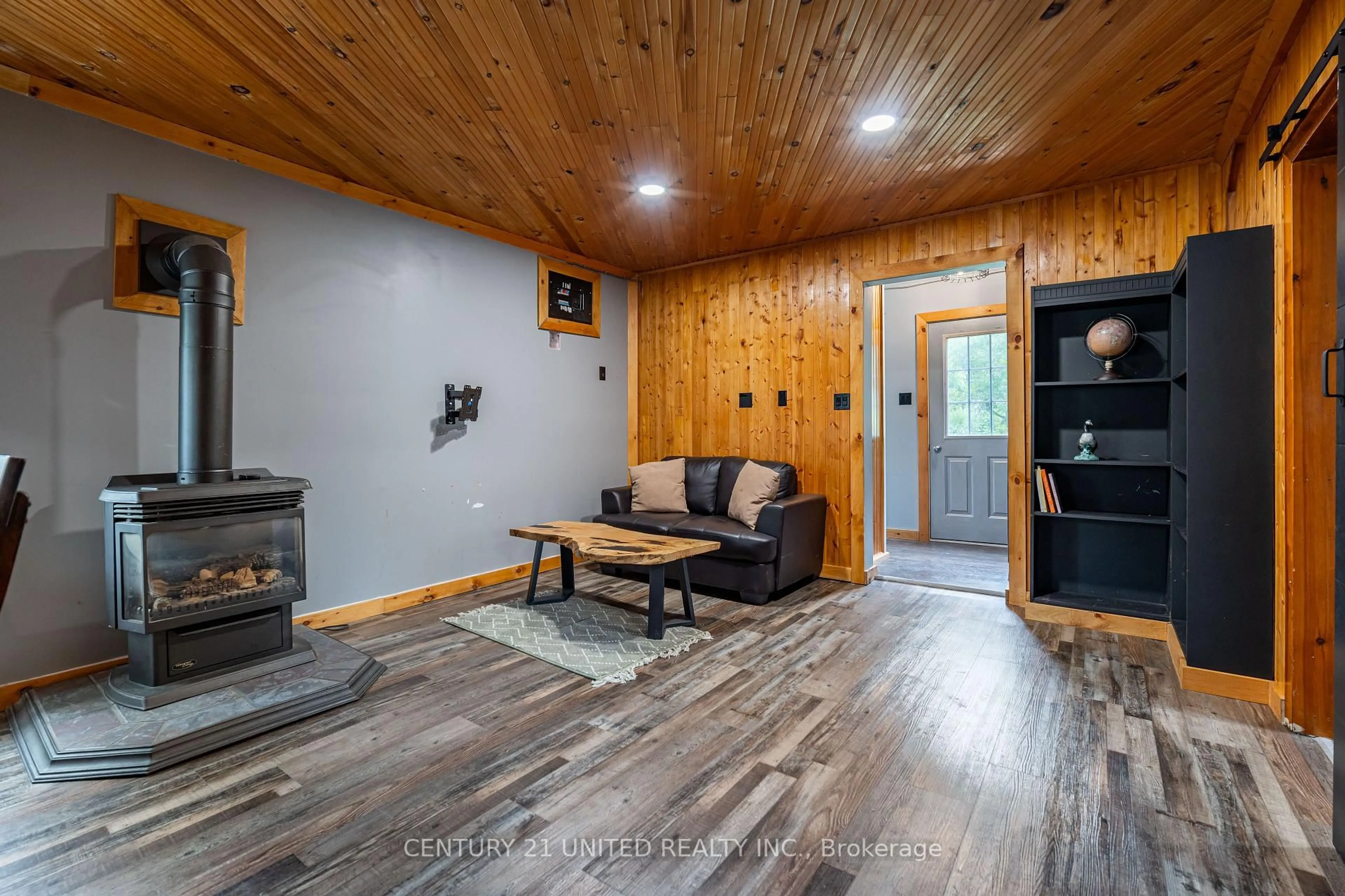 Living room with furniture, wood/laminate floor for 8186 Highway 28, North Kawartha Ontario K0L 1A0
