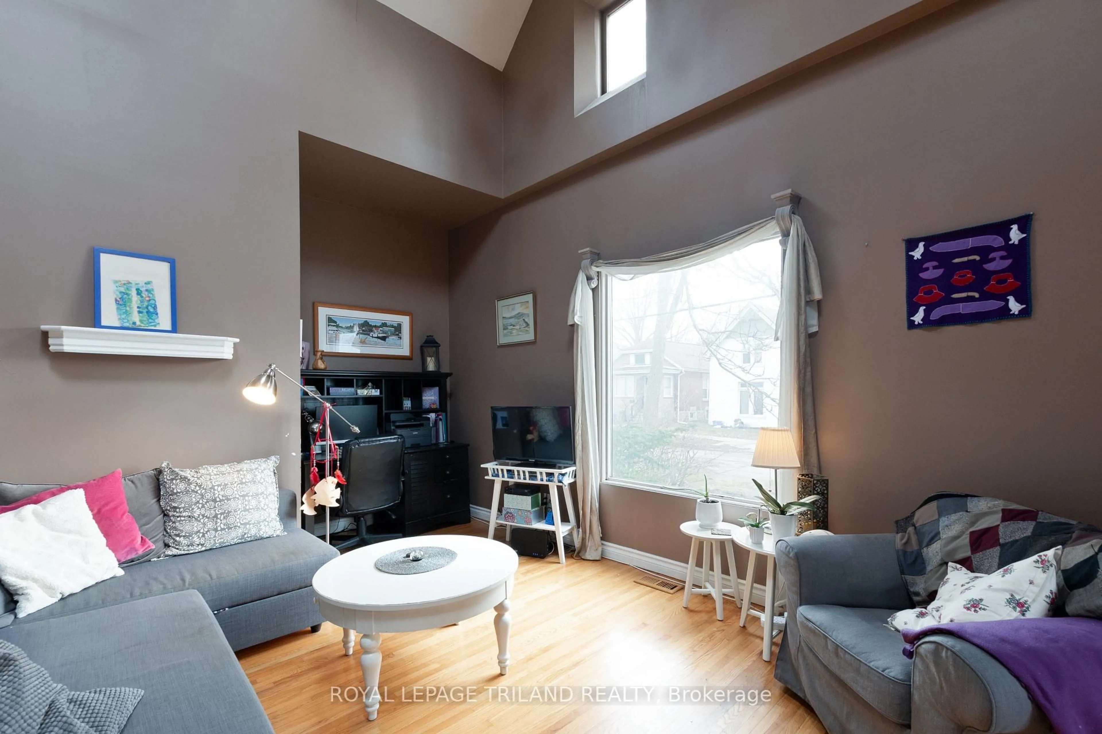 Living room with furniture, wood/laminate floor for 32 St Andrew St, London North Ontario N6H 1Z6