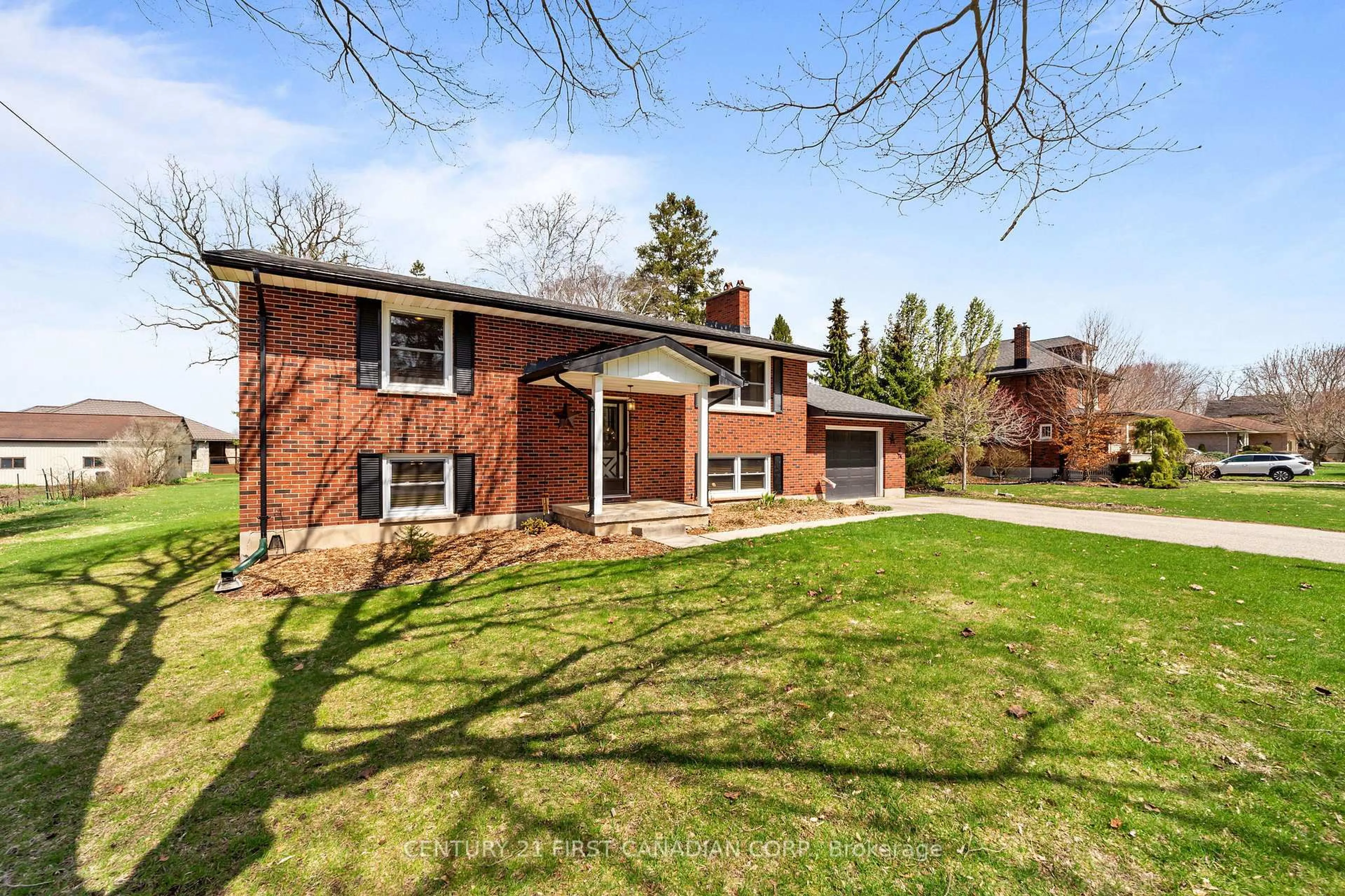 Home with brick exterior material, street for 180 Church St, North Middlesex Ontario N0M 1A0