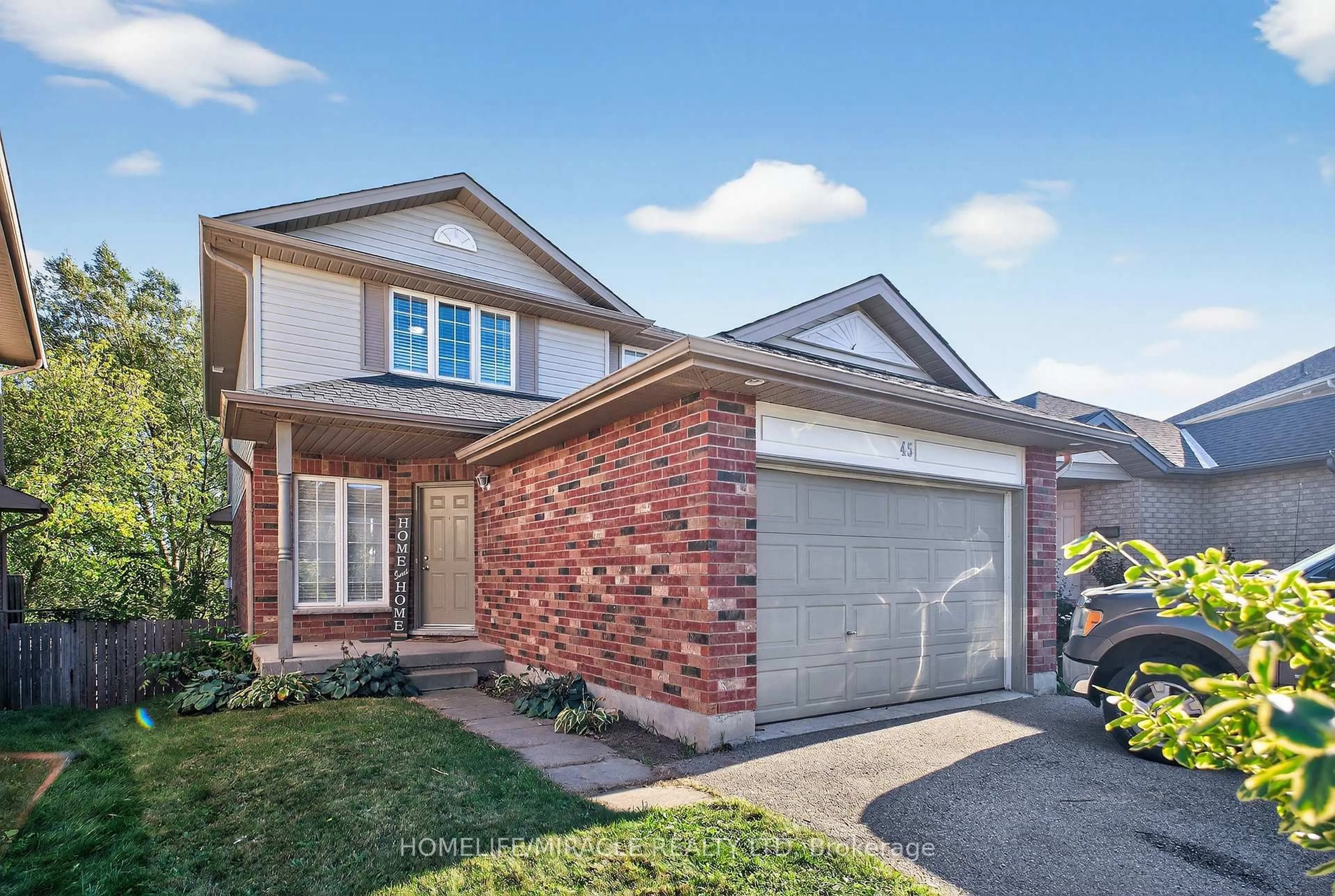 Home with brick exterior material, street for 45 Valleyhaven Lane, Guelph Ontario N1E 0A5