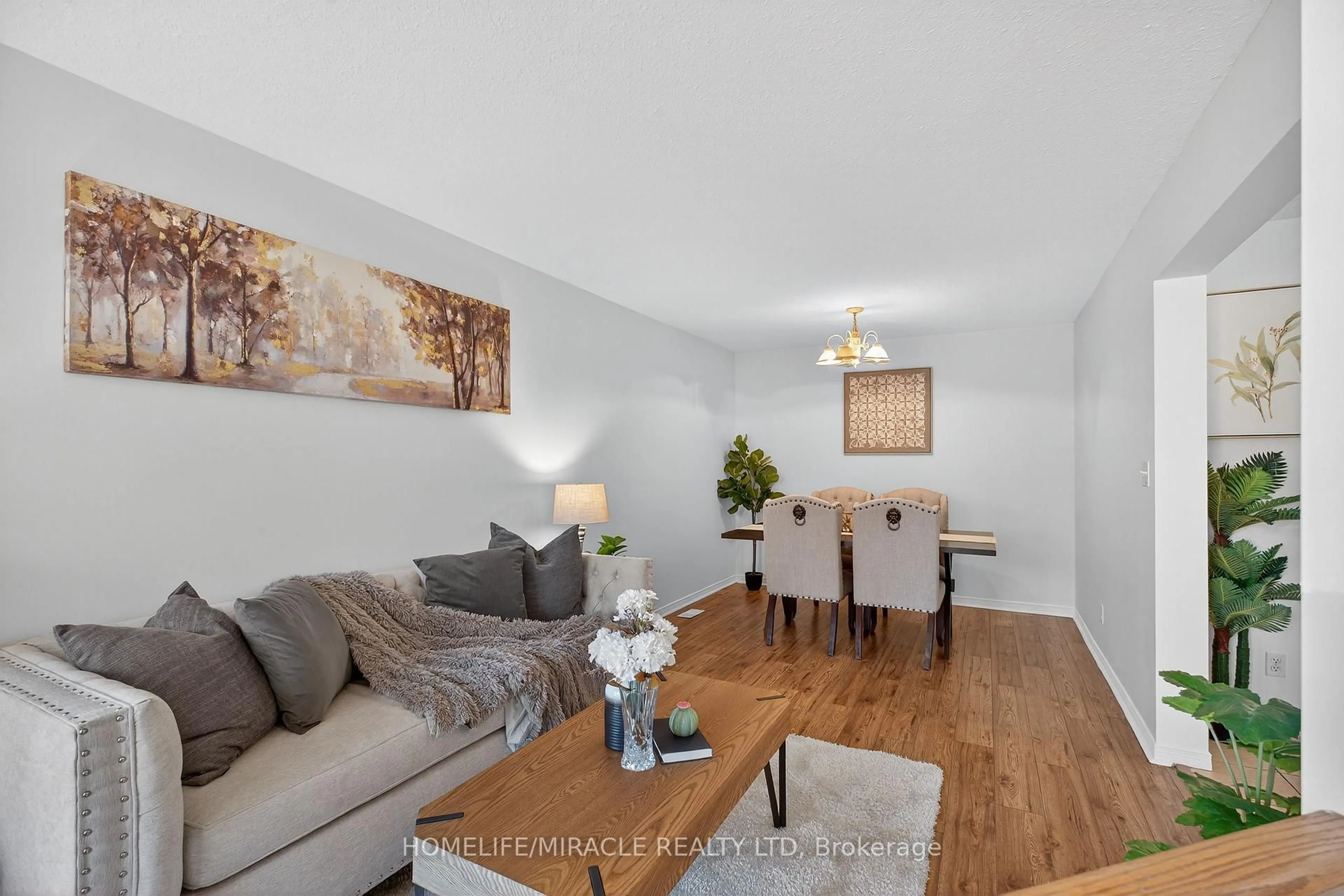 Living room with furniture, wood/laminate floor for 45 Valleyhaven Lane, Guelph Ontario N1E 0A5