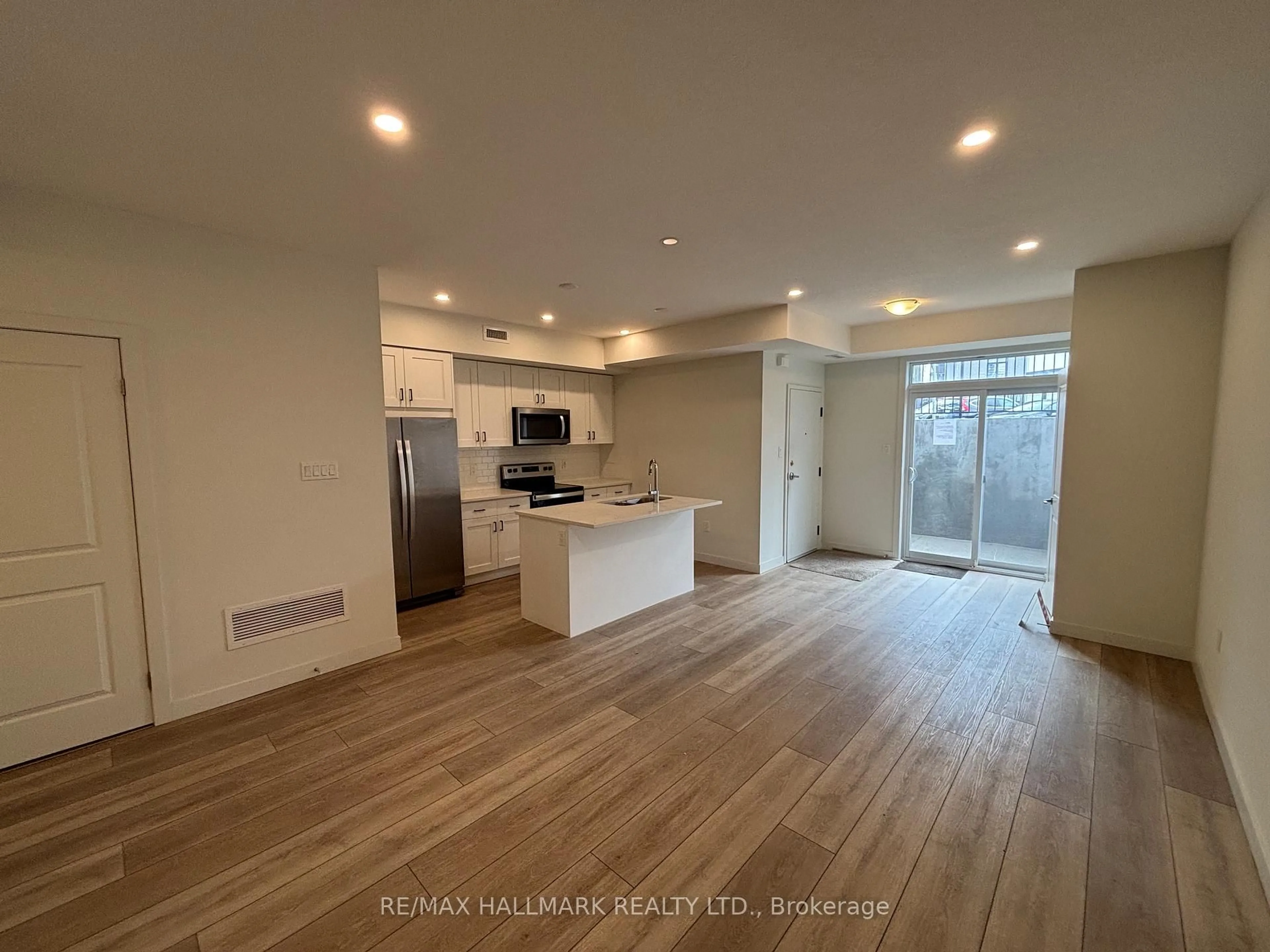 Open concept kitchen, wood/laminate floor for 405 Myers Rd #1, Cambridge Ontario N1P 0B6