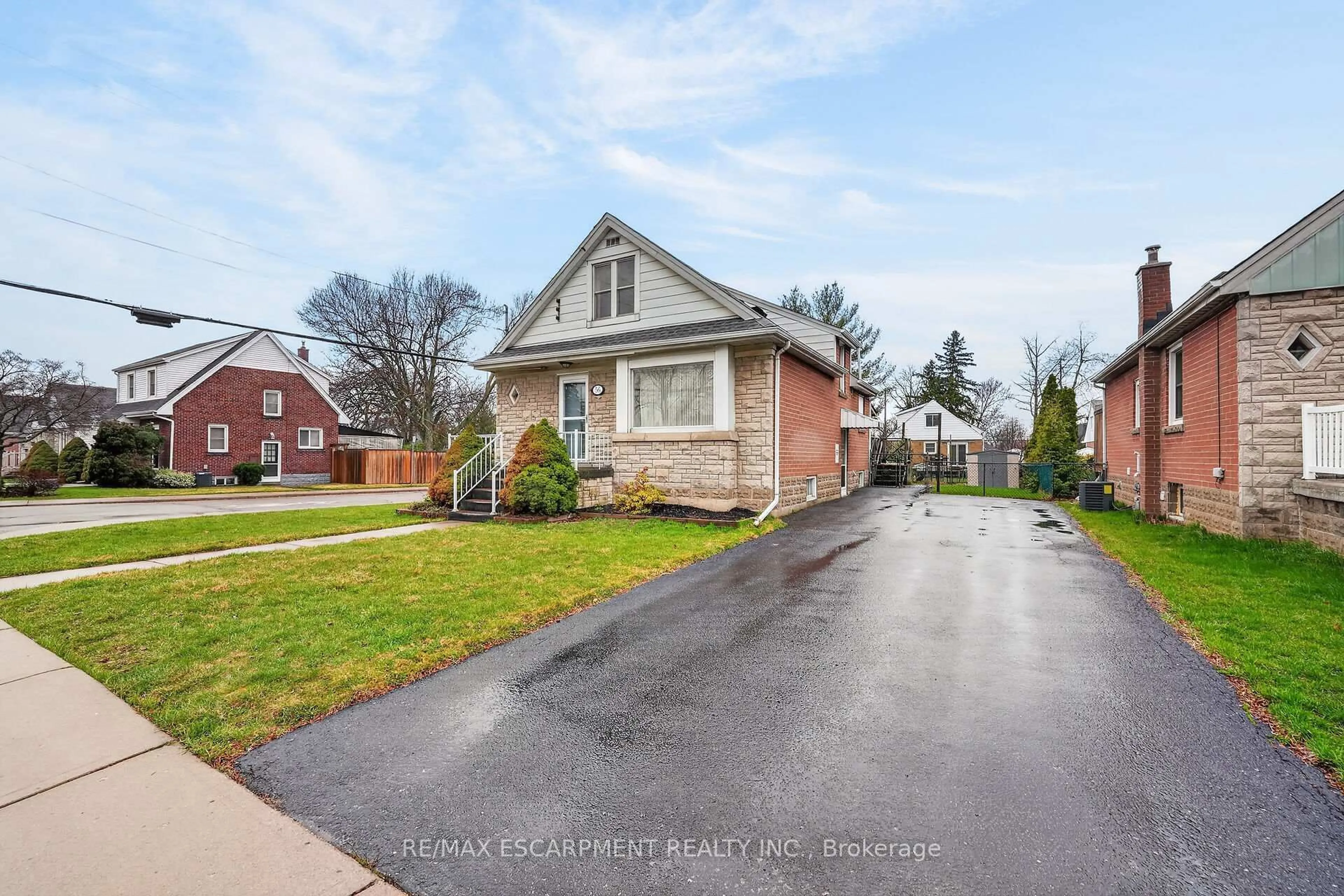 Home with brick exterior material, street for 56 West 1st St, Hamilton Ontario L9C 3C1