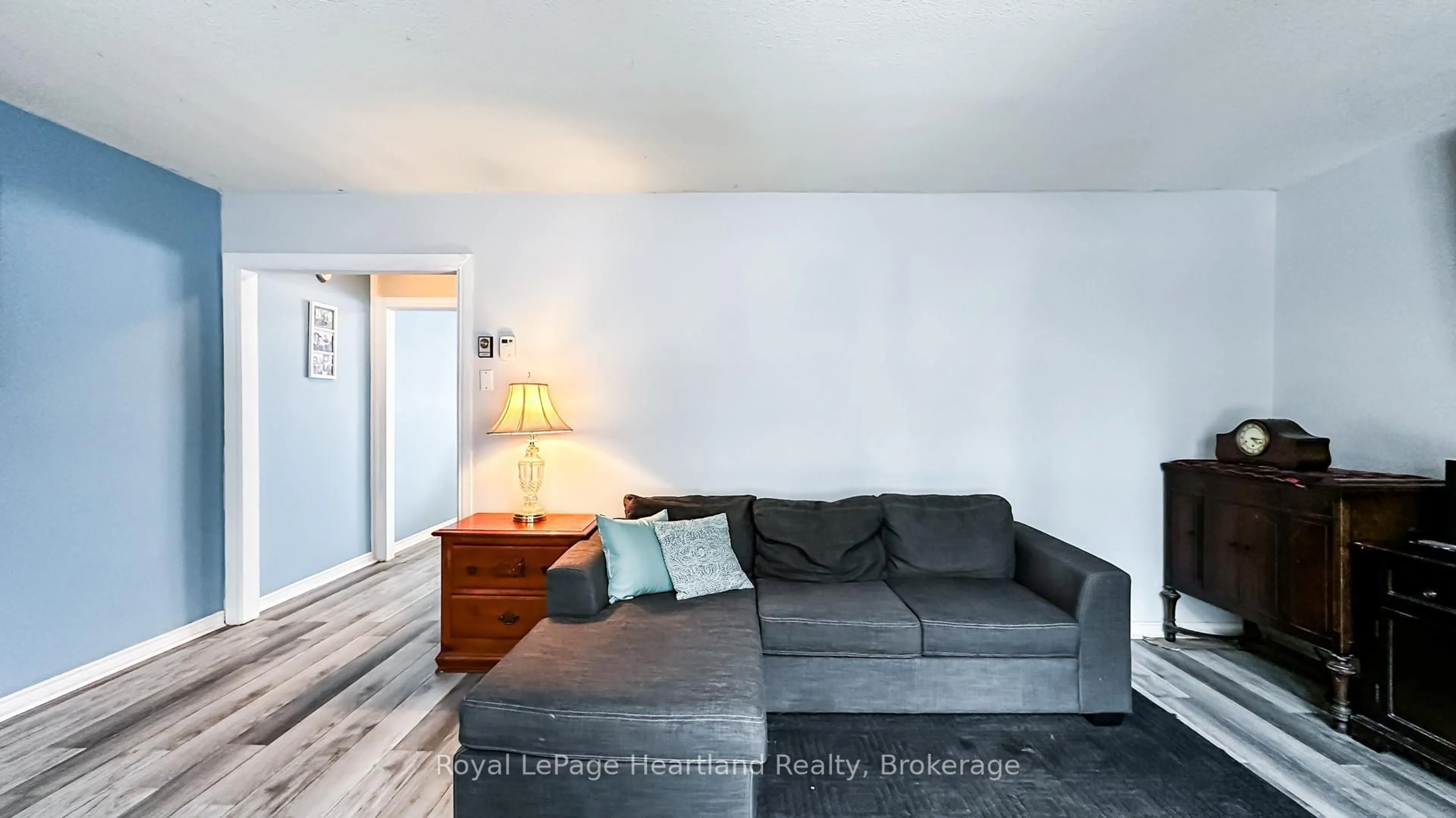 Living room with furniture, wood/laminate floor for 21 St Charles Pl, Huron East Ontario N0M 1L0