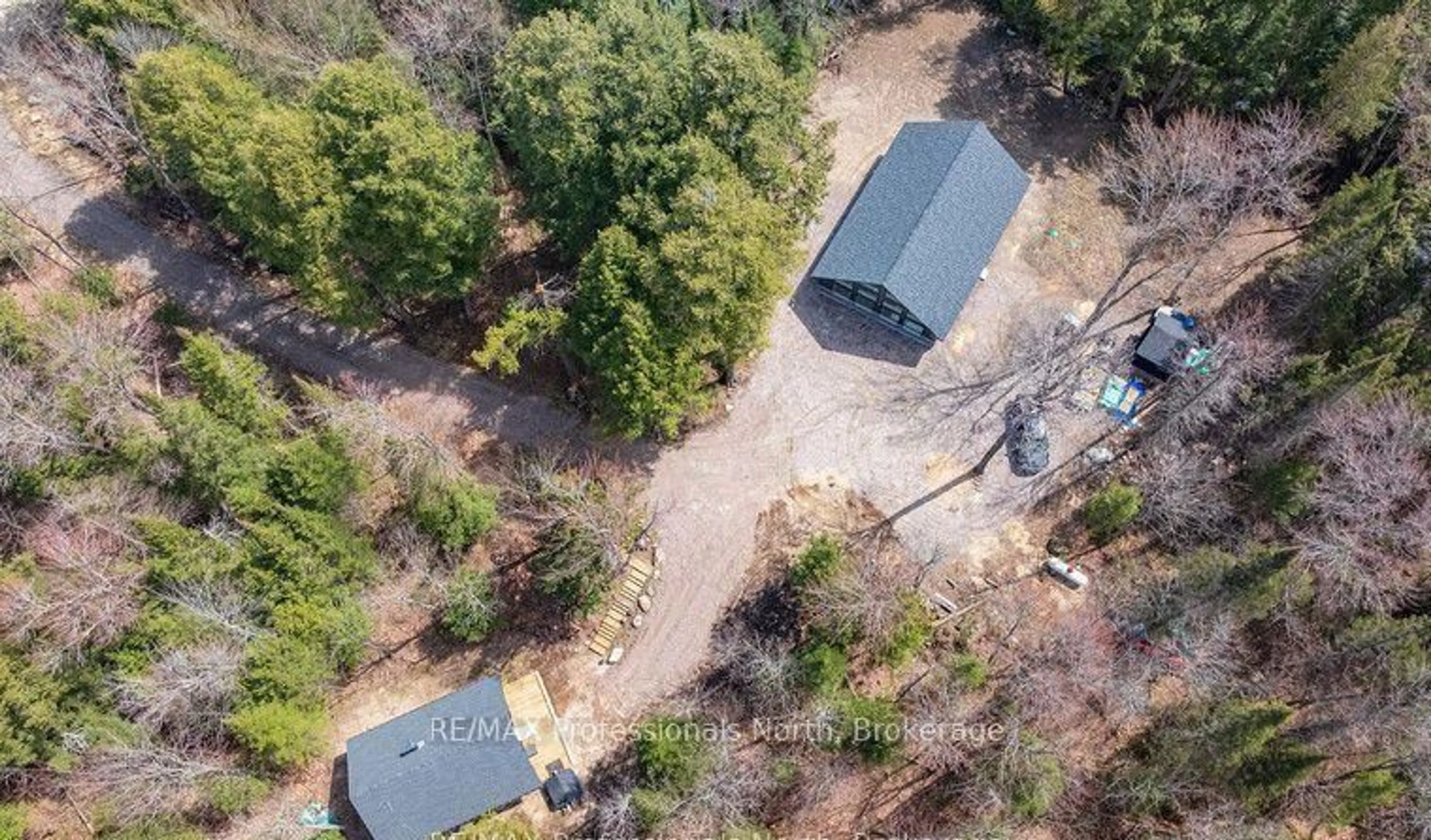 A pic from outside/outdoor area/front of a property/back of a property/a pic from drone, forest/trees view for 1820 Riding Ranch Rd, Machar Ontario P0A 1X0