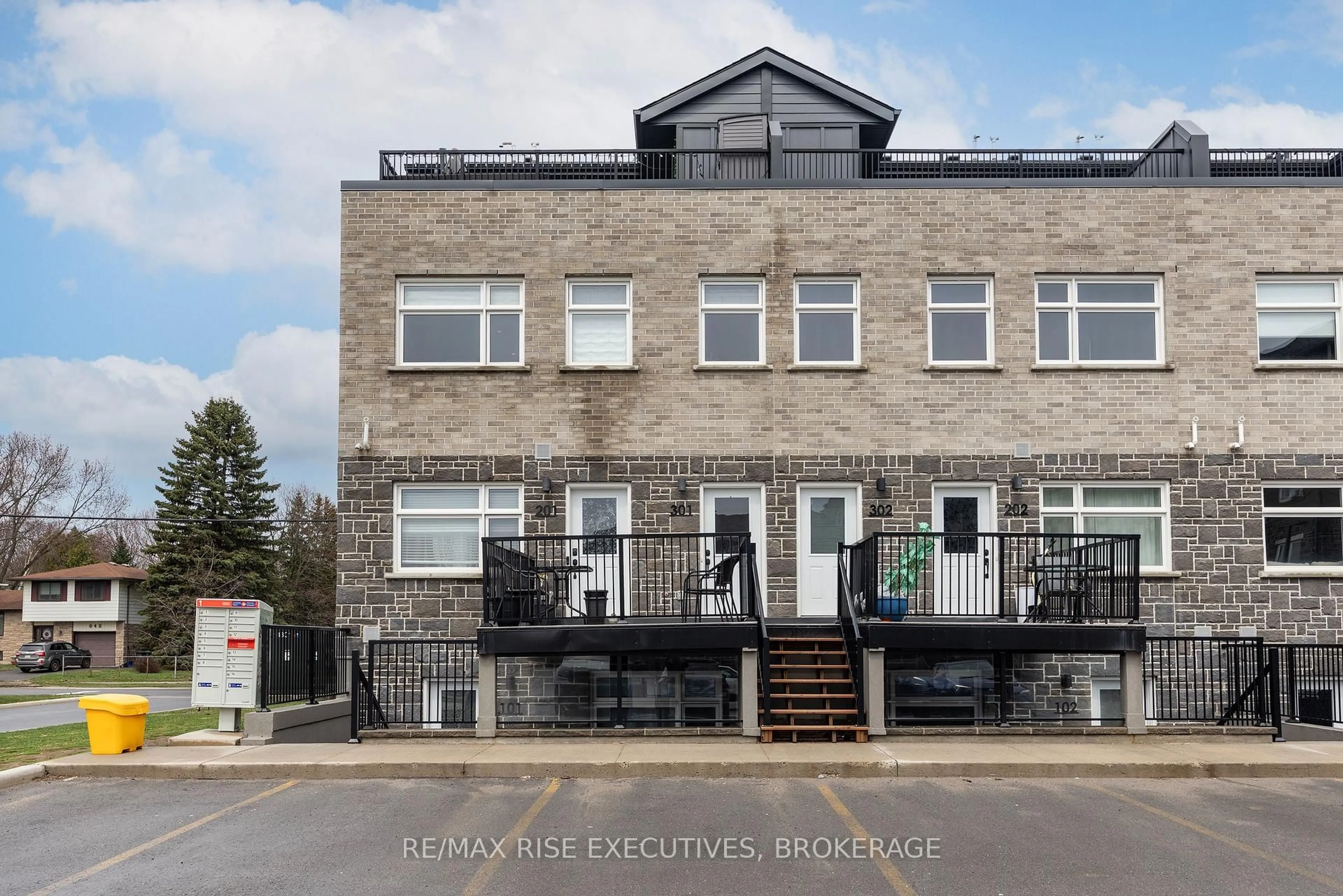 A pic from outside/outdoor area/front of a property/back of a property/a pic from drone, unknown for 809 Development Dr #301, Kingston Ontario K7M 0J4