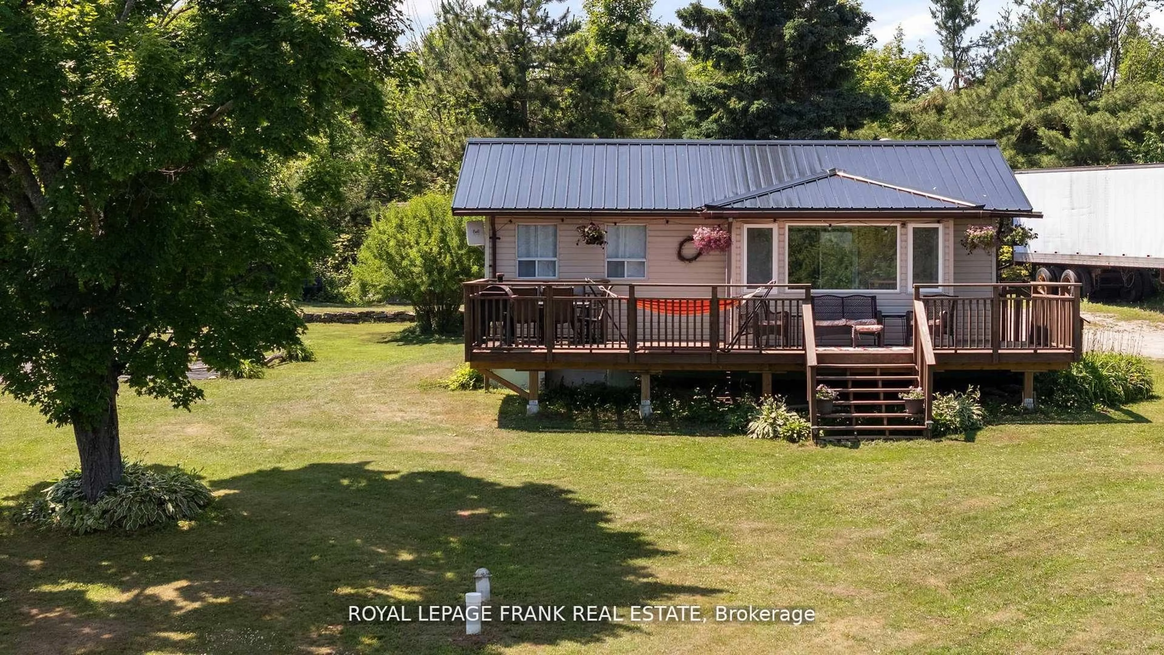 A pic from outside/outdoor area/front of a property/back of a property/a pic from drone, water/lake/river/ocean view for 2378 Monck Rd, Kawartha Lakes Ontario K0M 2B0