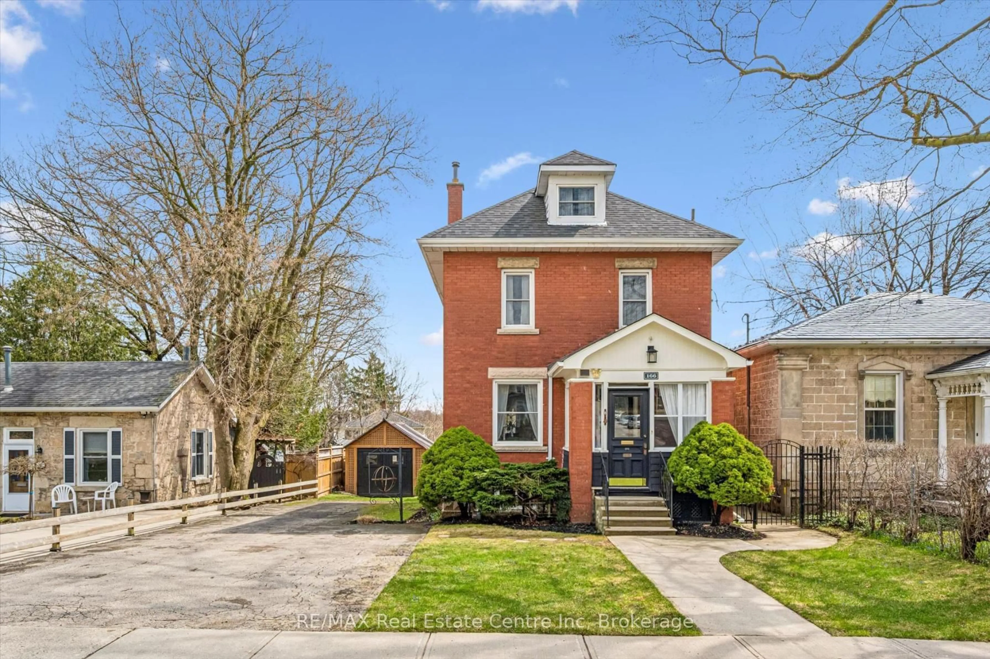 Home with brick exterior material, street for 166 WATERLOO Ave, Guelph Ontario N1H 3J1