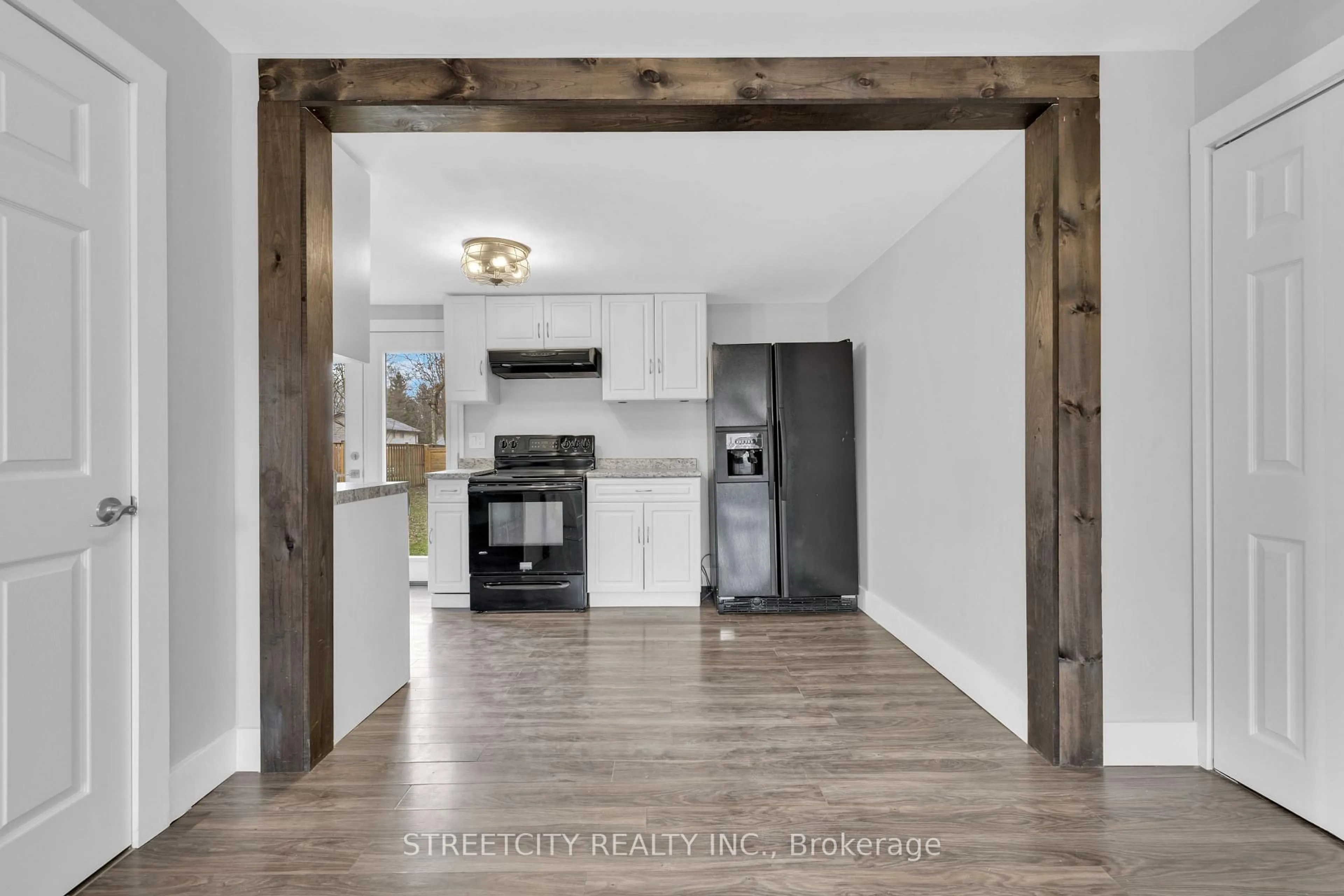 Open concept kitchen, wood/laminate floor for 190 King St, Southwest Middlesex Ontario N0L 1M0