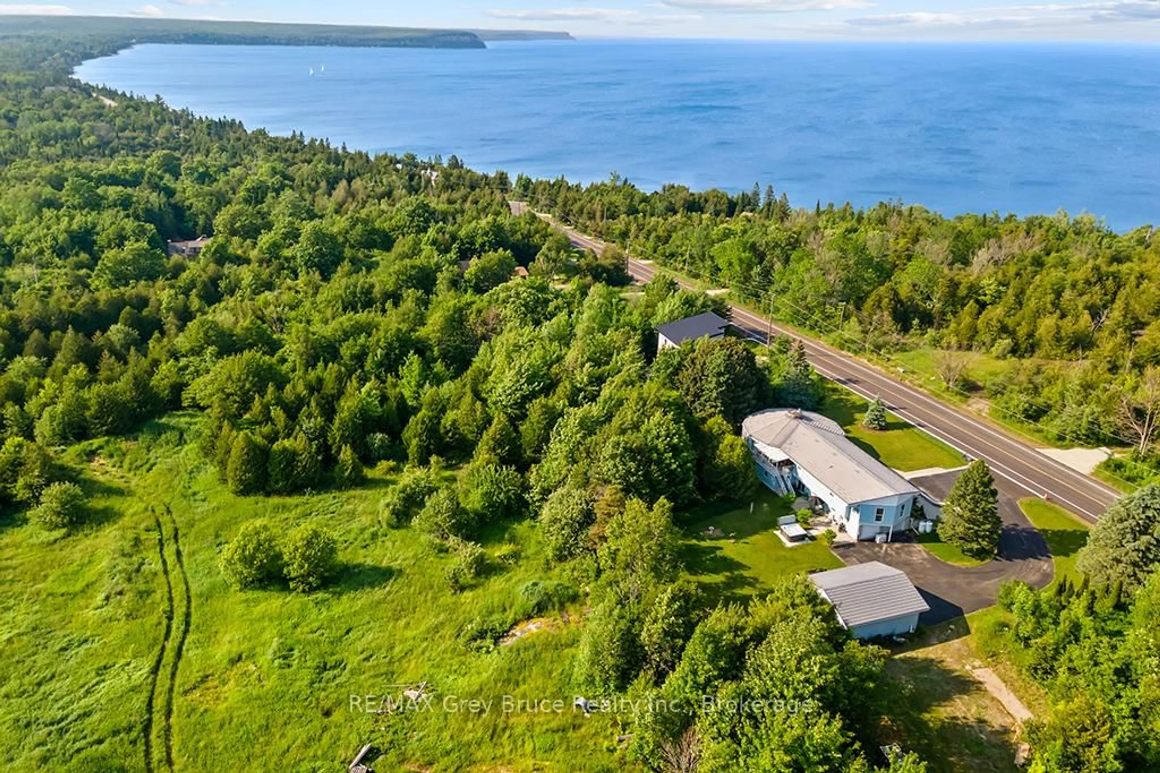 A pic from outside/outdoor area/front of a property/back of a property/a pic from drone, water/lake/river/ocean view for 15 Isthmus bay Rd, Northern Bruce Peninsula Ontario N0H 1W0