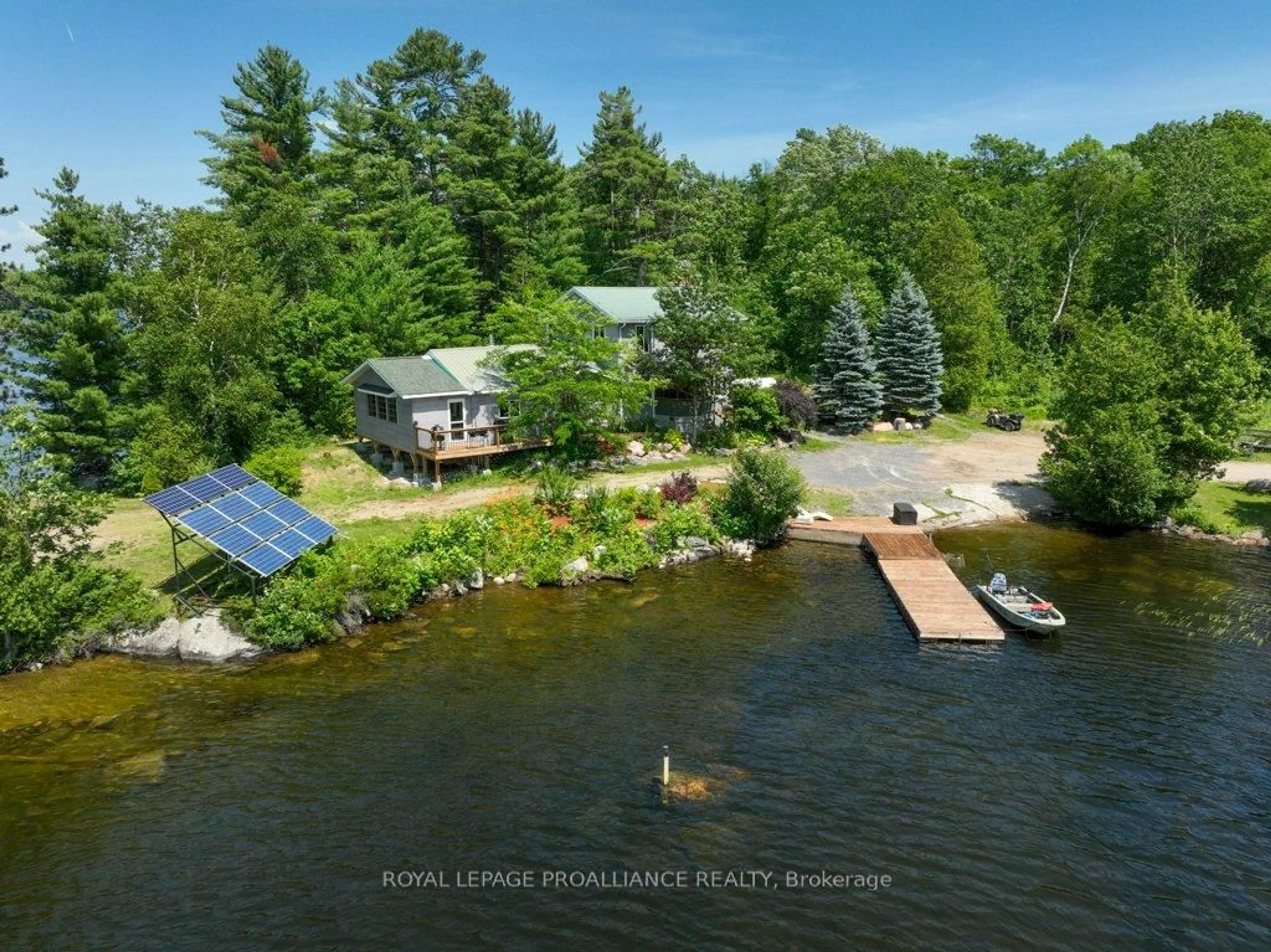 A pic from outside/outdoor area/front of a property/back of a property/a pic from drone, water/lake/river/ocean view for 2475 Alfs Bay Lane, Arden Ontario K0H 1B0