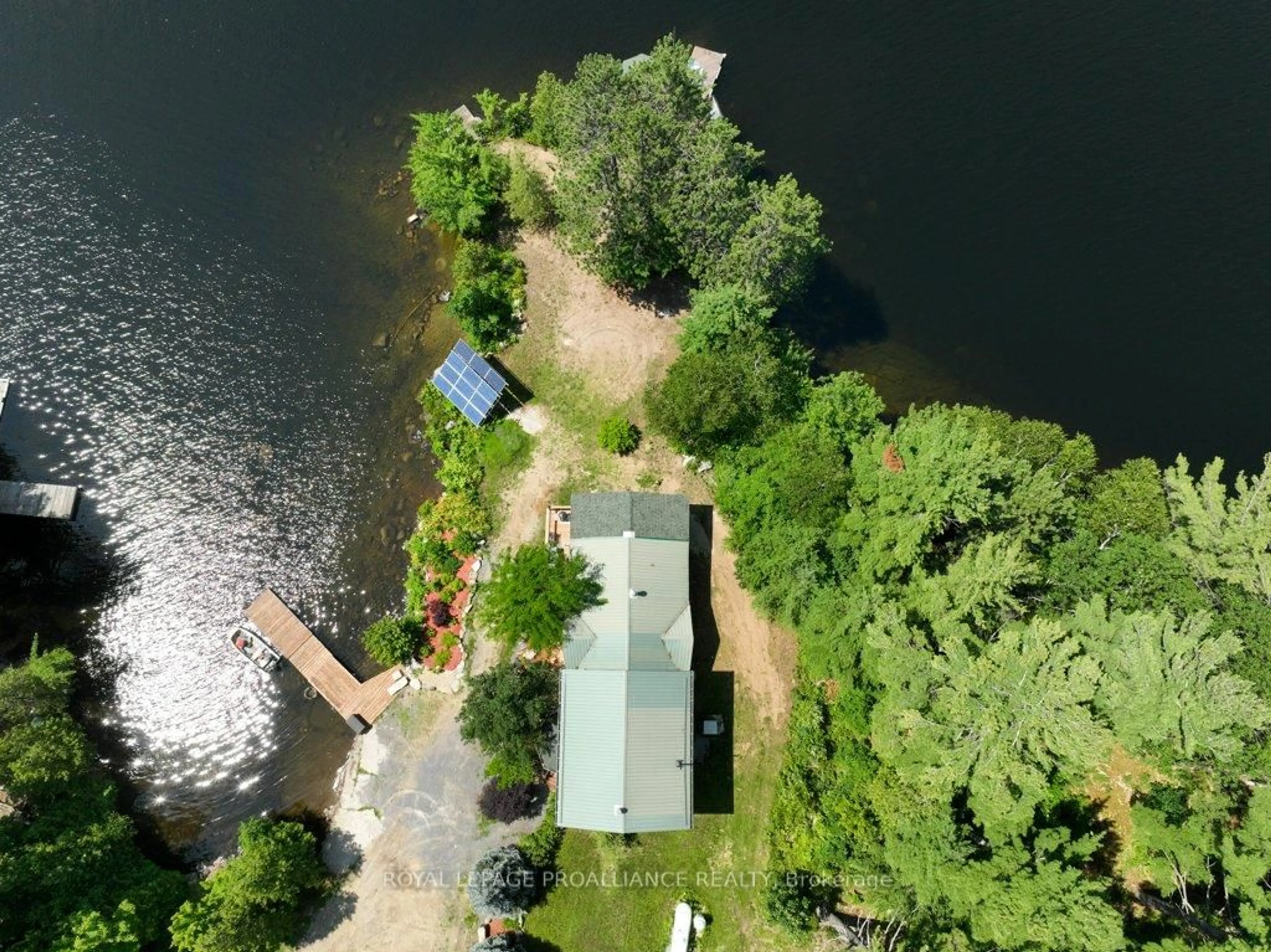 A pic from outside/outdoor area/front of a property/back of a property/a pic from drone, water/lake/river/ocean view for 2475 Alfs Bay Lane, Arden Ontario K0H 1B0