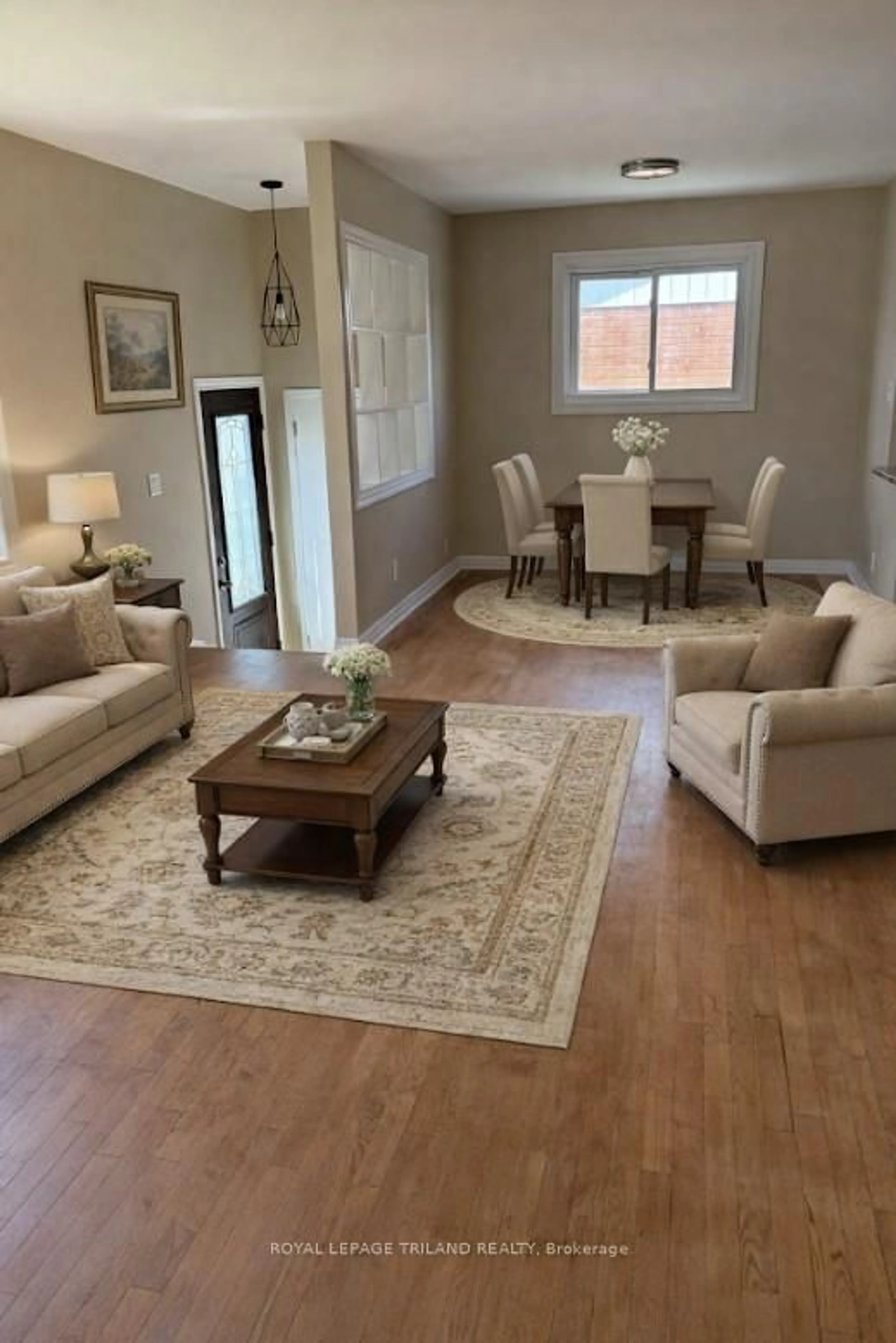 Living room with furniture, wood/laminate floor for 1548 Dale St, London East Ontario N5V 1X9