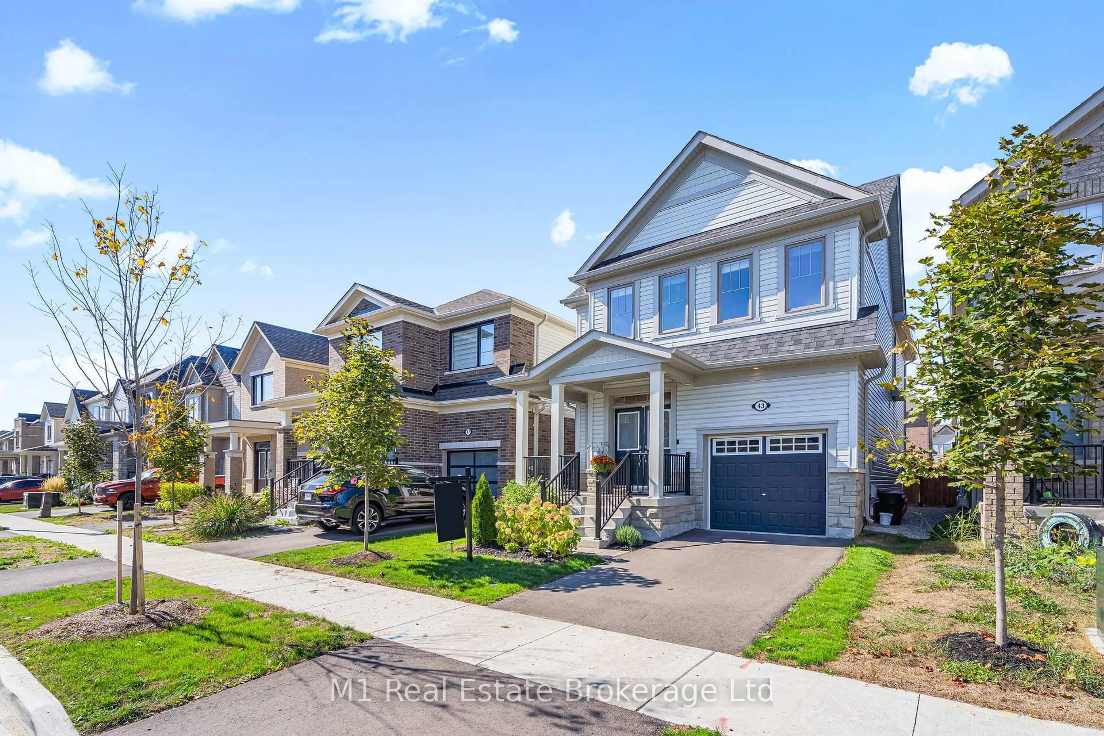 Home with brick exterior material, street for 43 Harpin Way, Centre Wellington Ontario N1M 0H7