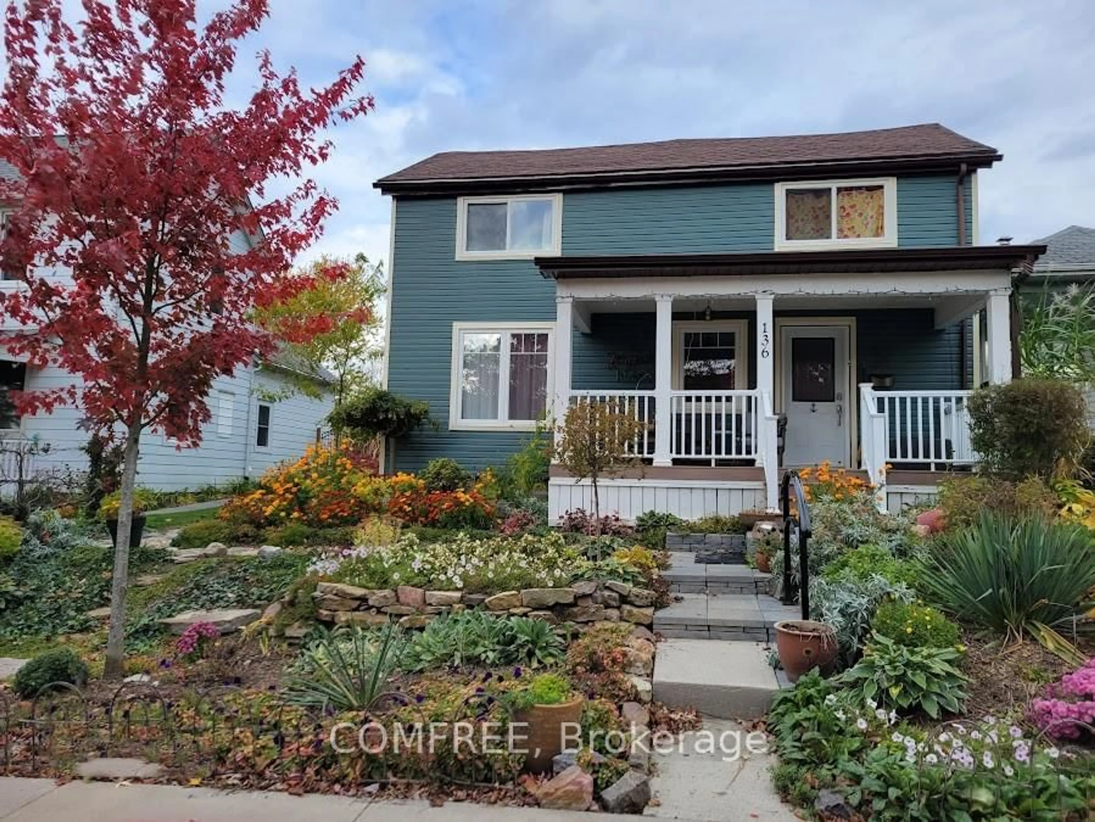 Home with vinyl exterior material, street for 136 John St, Gananoque Ontario K7G 1A5