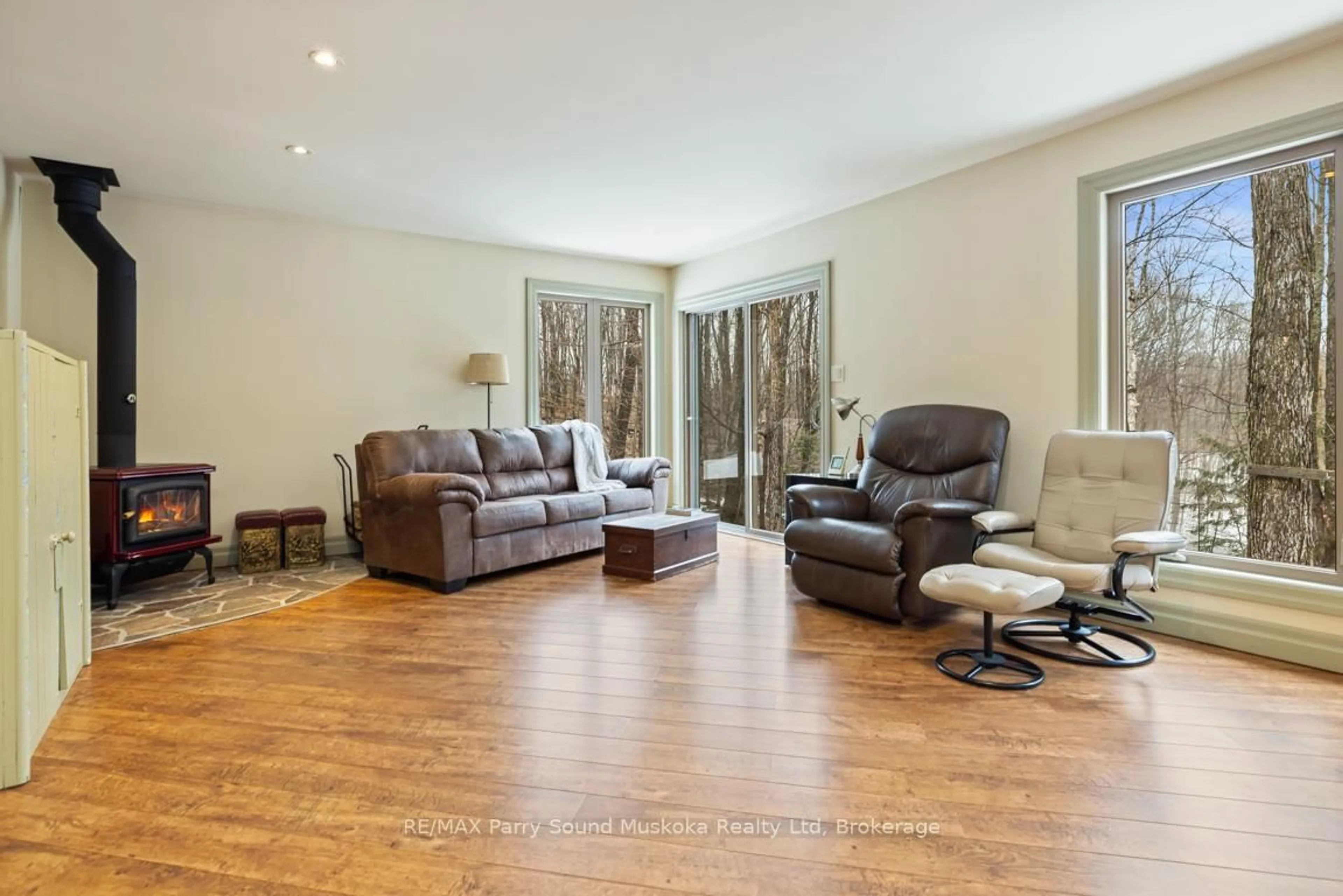 Living room with furniture, wood/laminate floor for 64 124 Highway, McDougall Ontario P2A 2W7