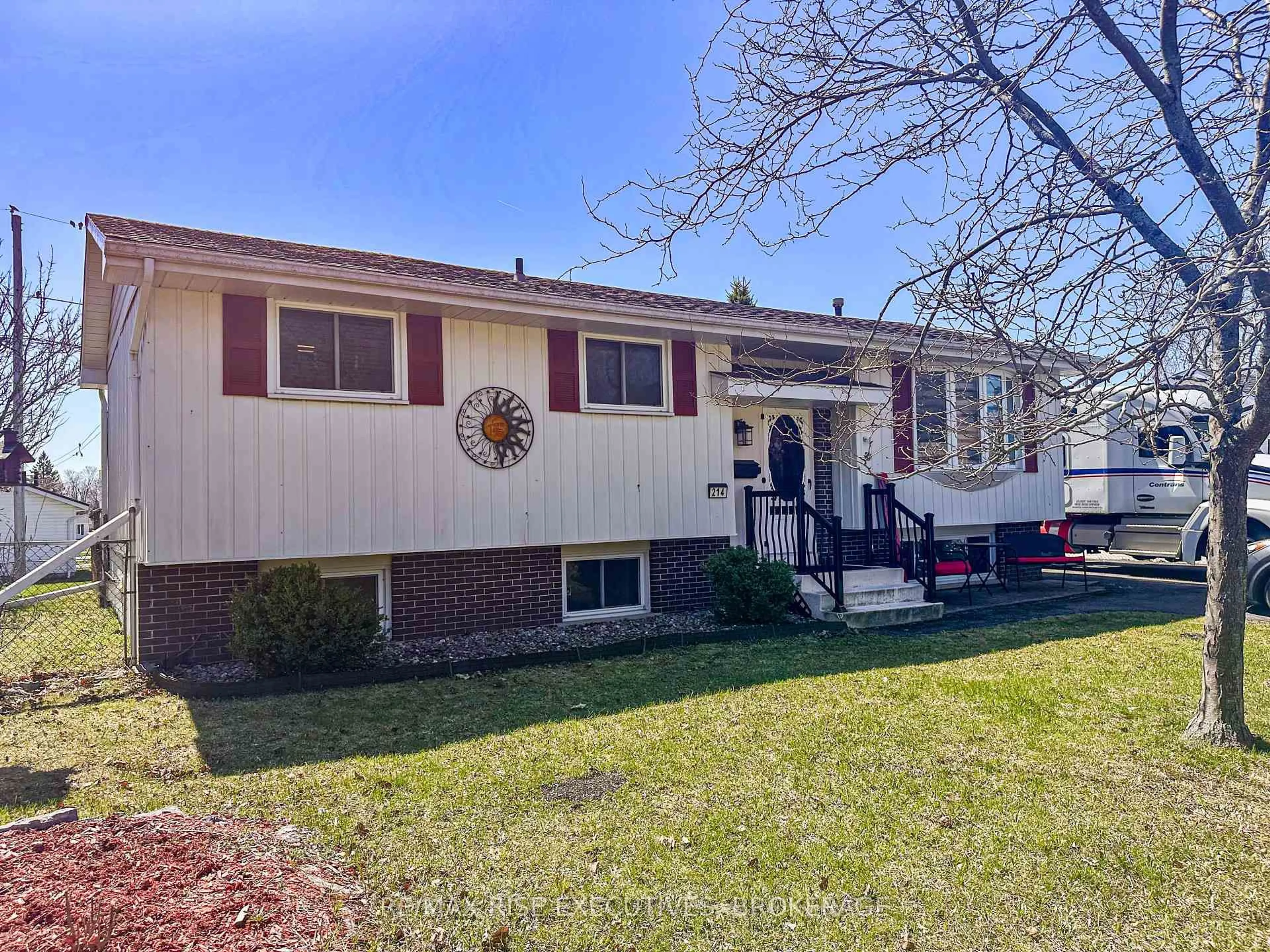 Home with vinyl exterior material, street for 214 Amherst Dr, Loyalist Ontario K7N 1T4