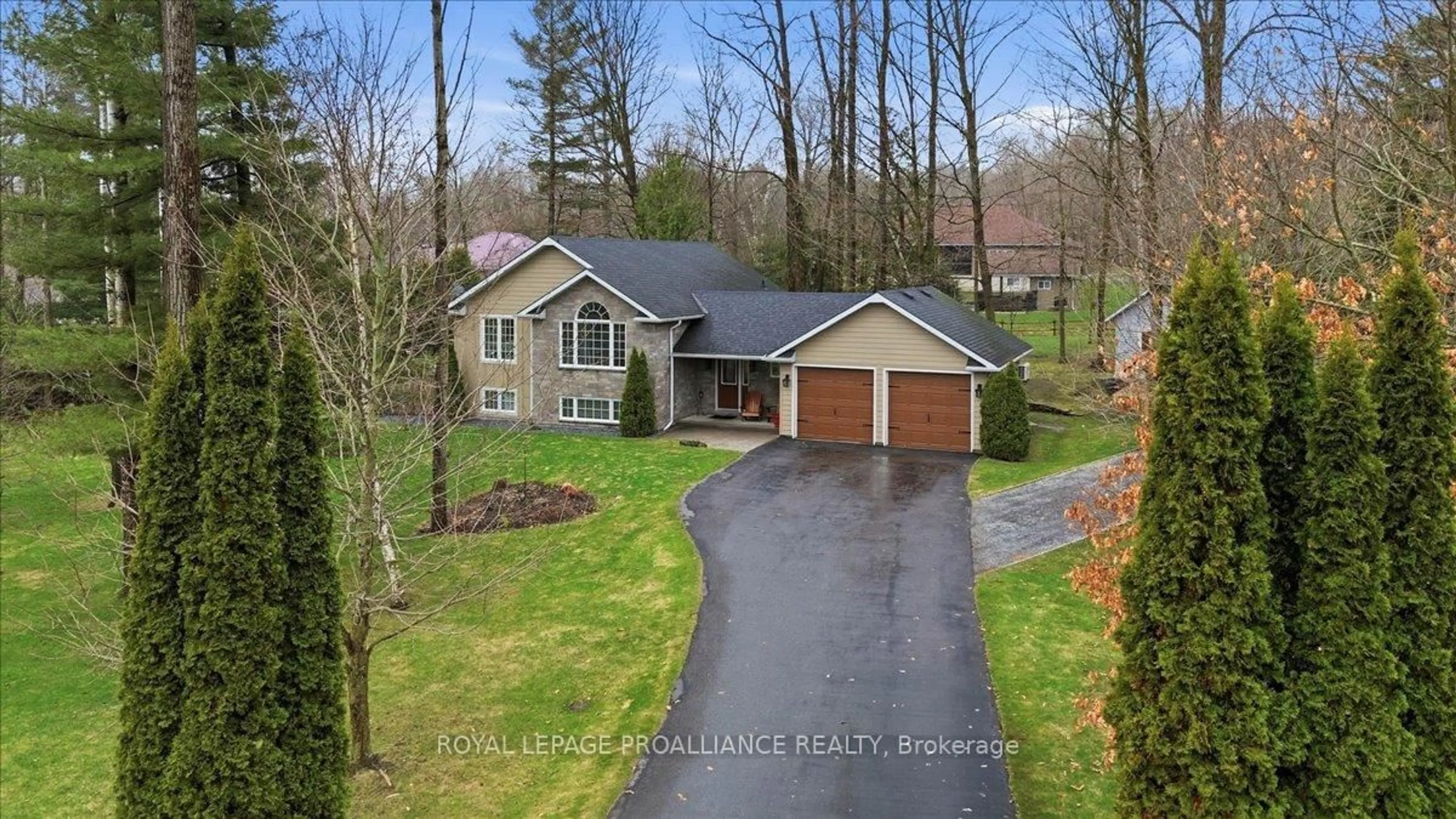 A pic from outside/outdoor area/front of a property/back of a property/a pic from drone, unknown for 80 Whispering Woods Dr, Trenton Ontario K8V 5P7