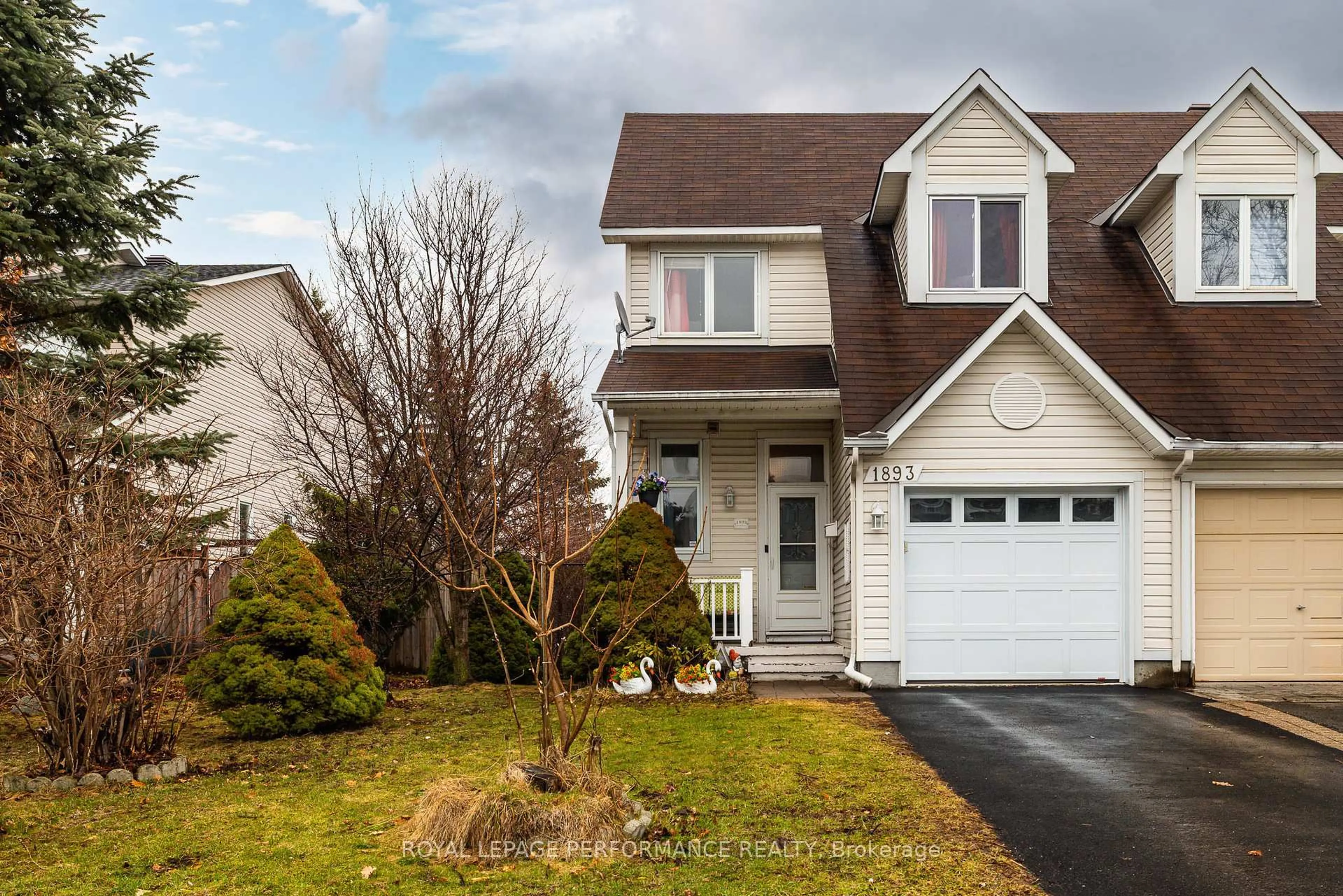 Home with vinyl exterior material, street for 1893 Hennessy Cres, Ottawa Ontario K4A 3X8