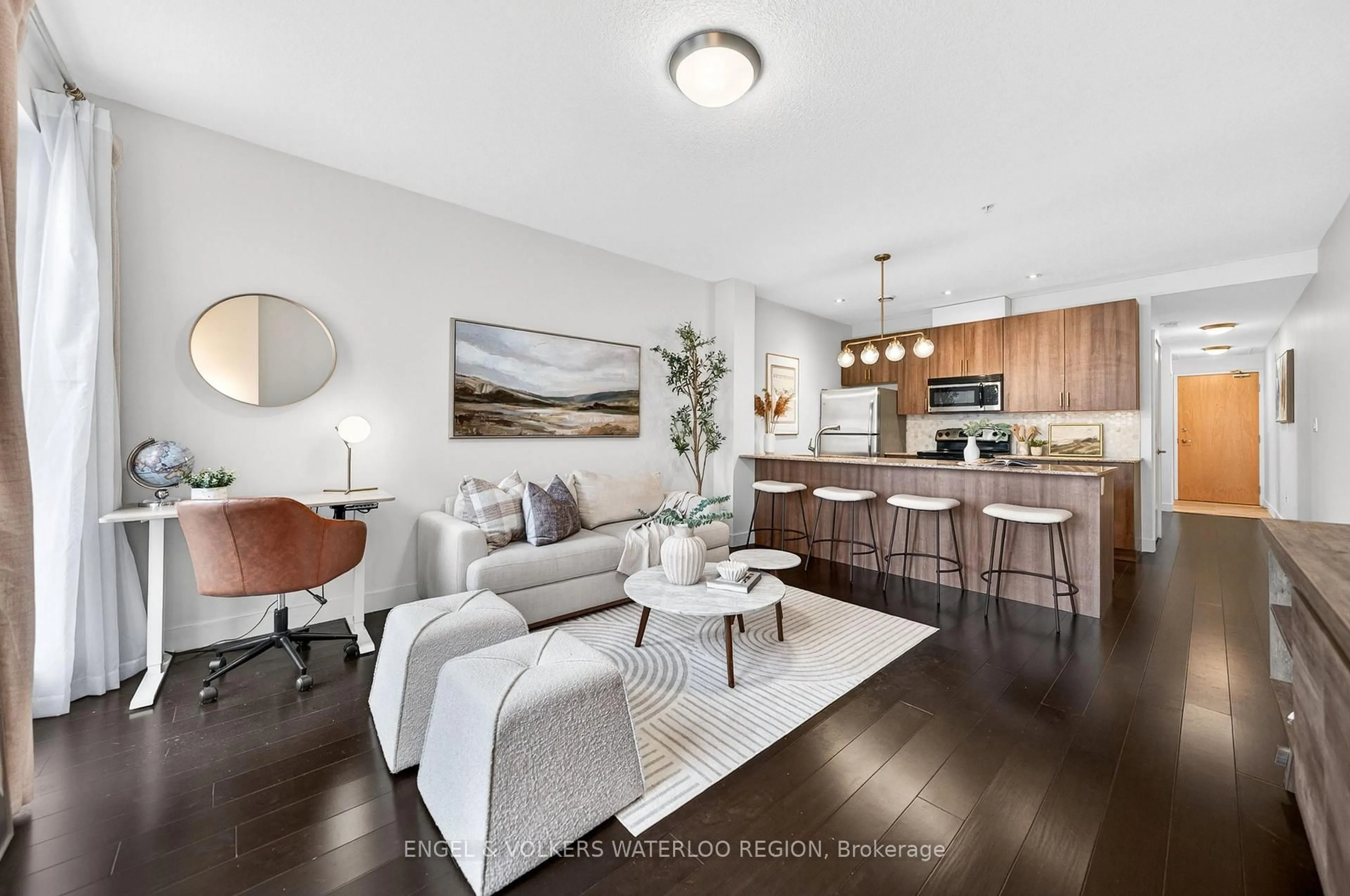 Living room with furniture, wood/laminate floor for 188 King St #207, Waterloo Ontario N2J 0C6