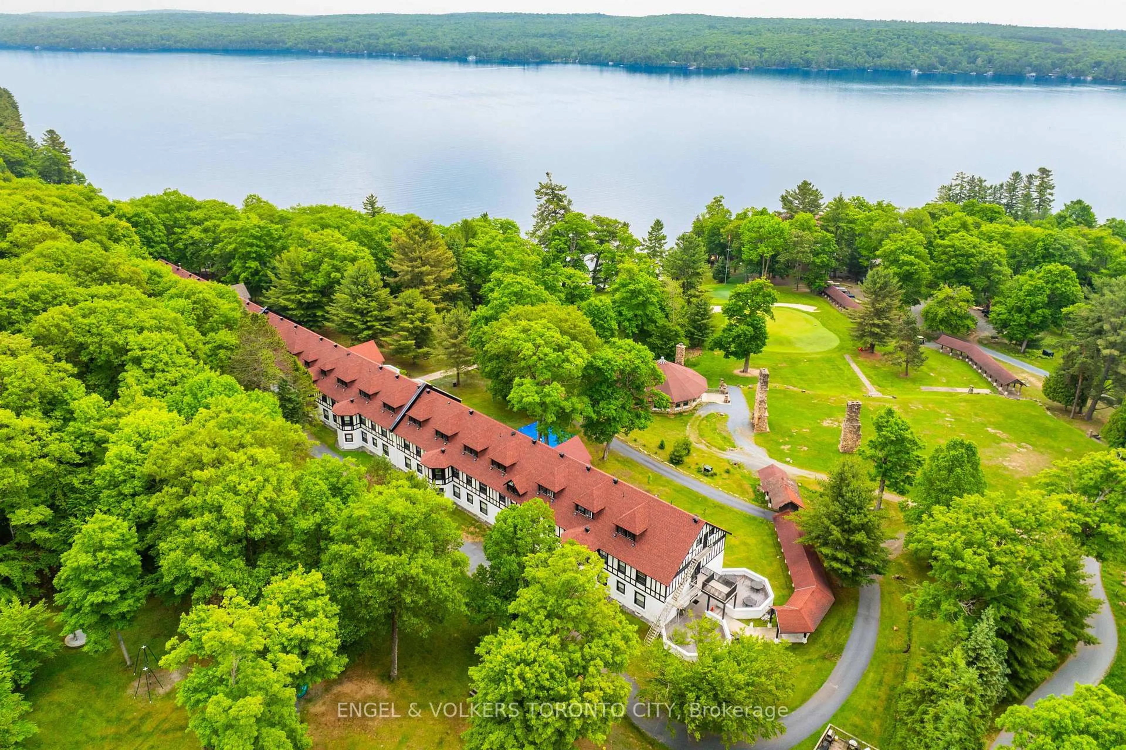 A pic from outside/outdoor area/front of a property/back of a property/a pic from drone, water/lake/river/ocean view for 12 Bigwin Island #319, Lake of Bays Ontario P0B 1A0