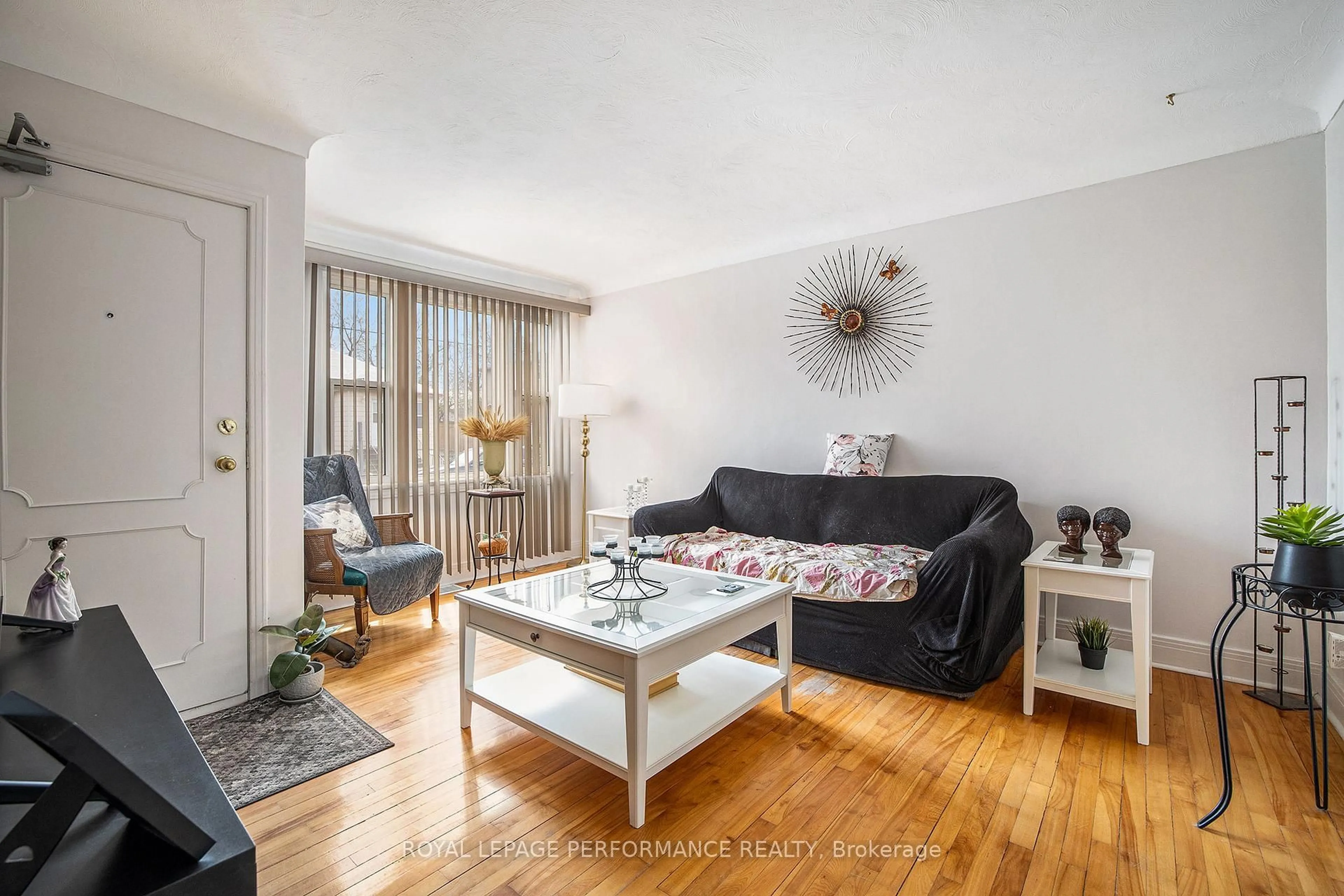 Living room with furniture, wood/laminate floor for 327-329 Shakespeare St, Ottawa Ontario K1L 5M1