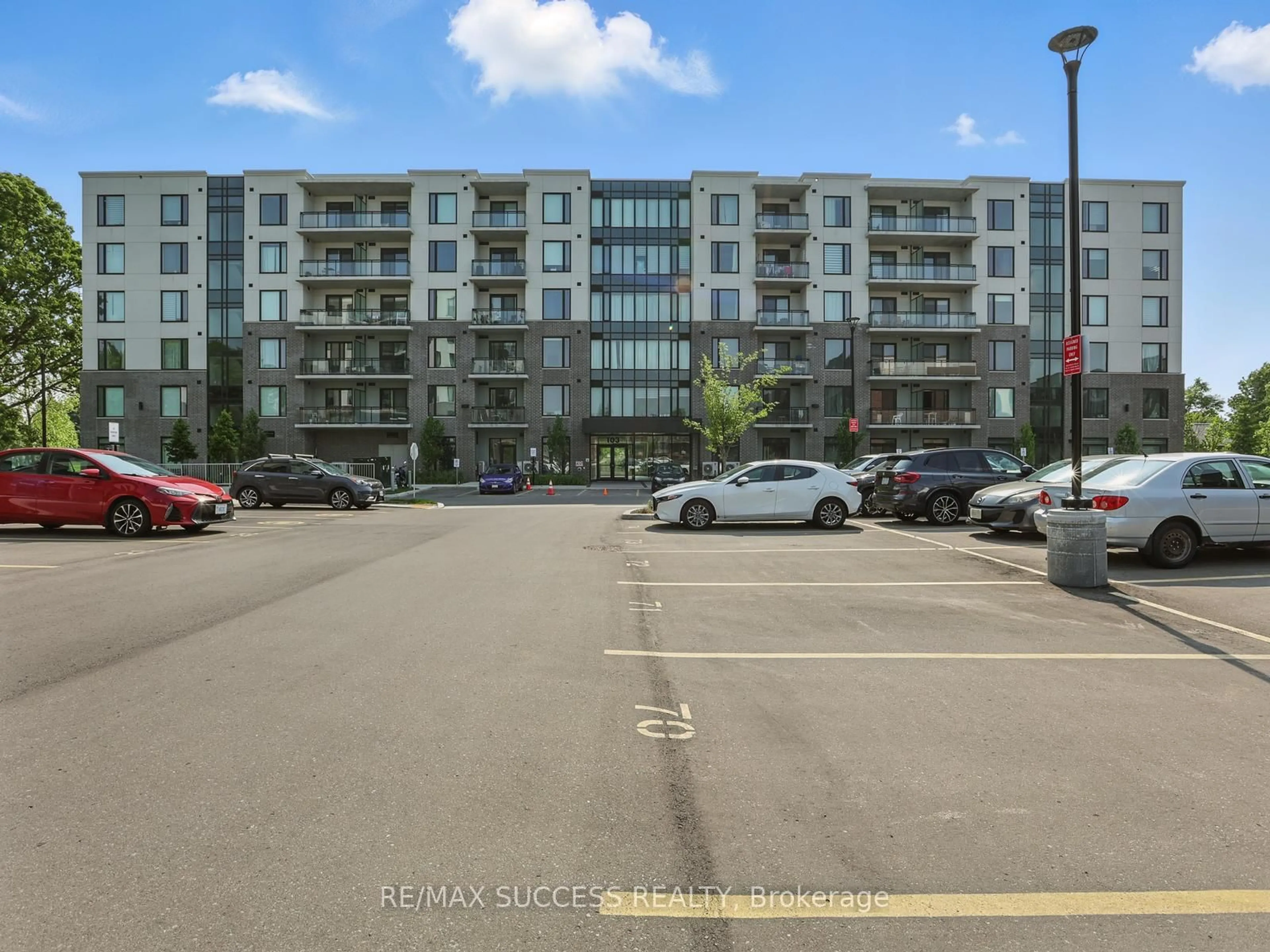 A pic from outside/outdoor area/front of a property/back of a property/a pic from drone, street for 103 Roger St #411, Waterloo Ontario N2J 0G2