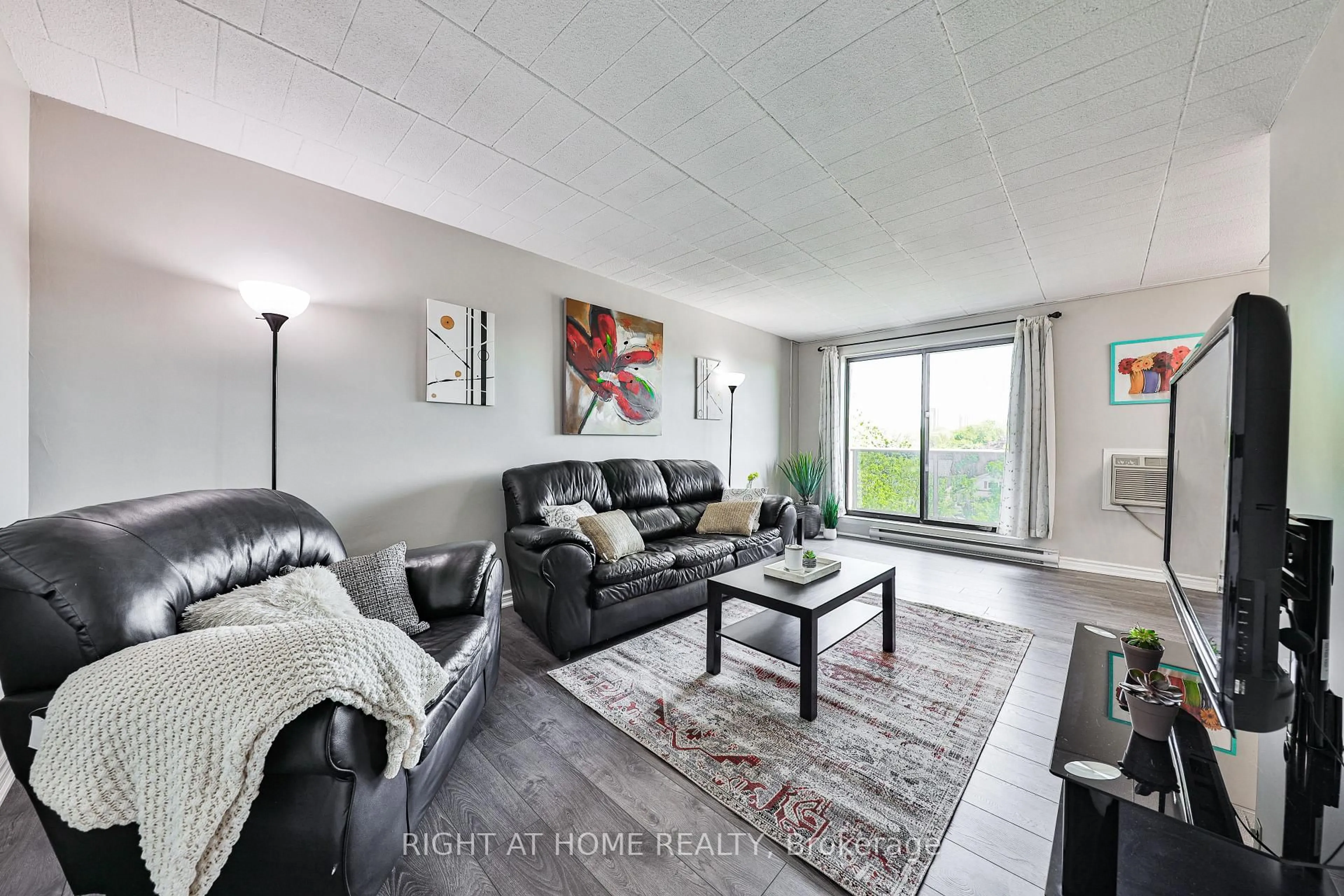 Living room with furniture, wood/laminate floor for 29 West Ave #411, Kitchener Ontario N2M 5E4