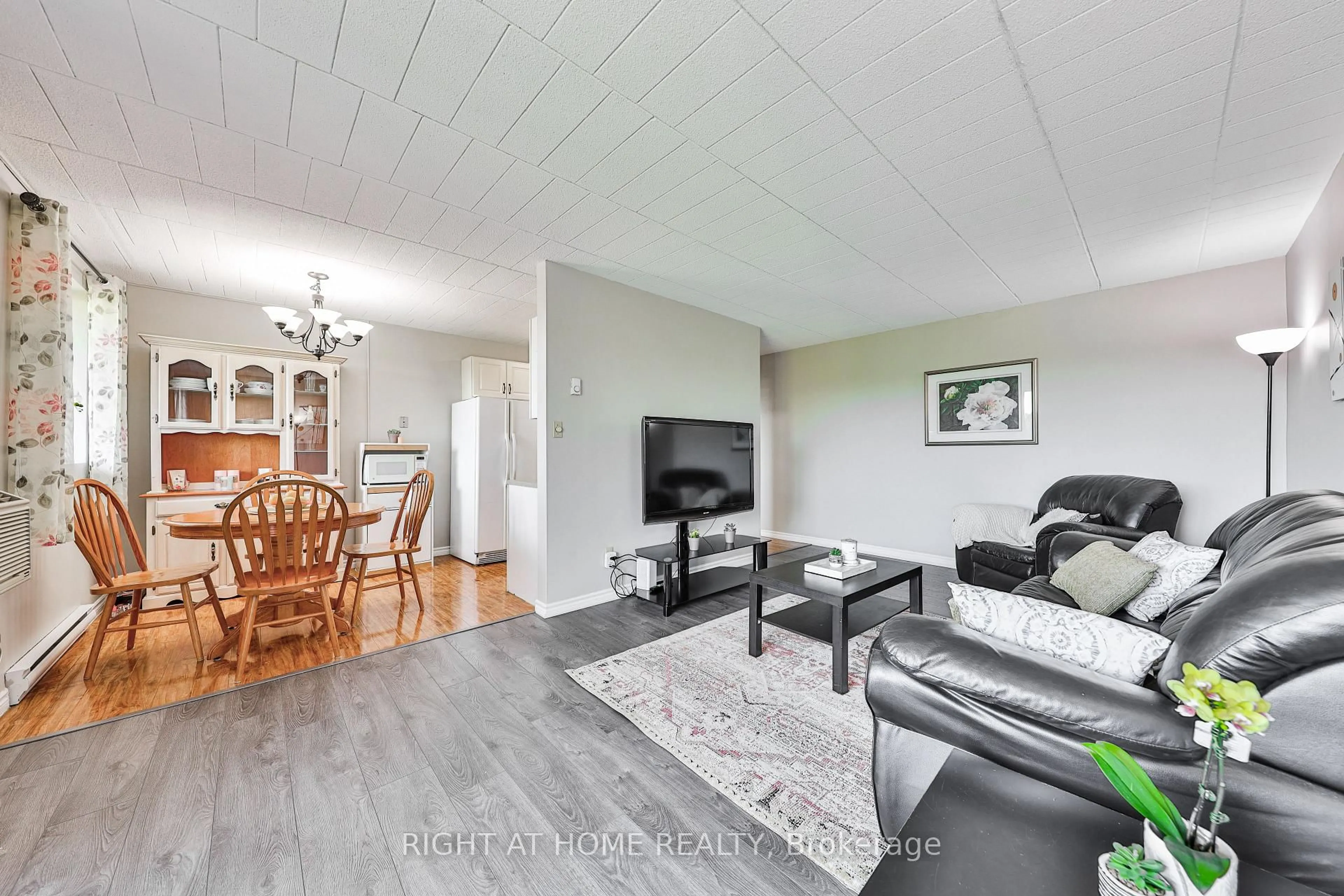 Living room with furniture, wood/laminate floor for 29 West Ave #411, Kitchener Ontario N2M 5E4